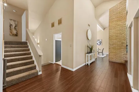 a view of entryway with wooden floor