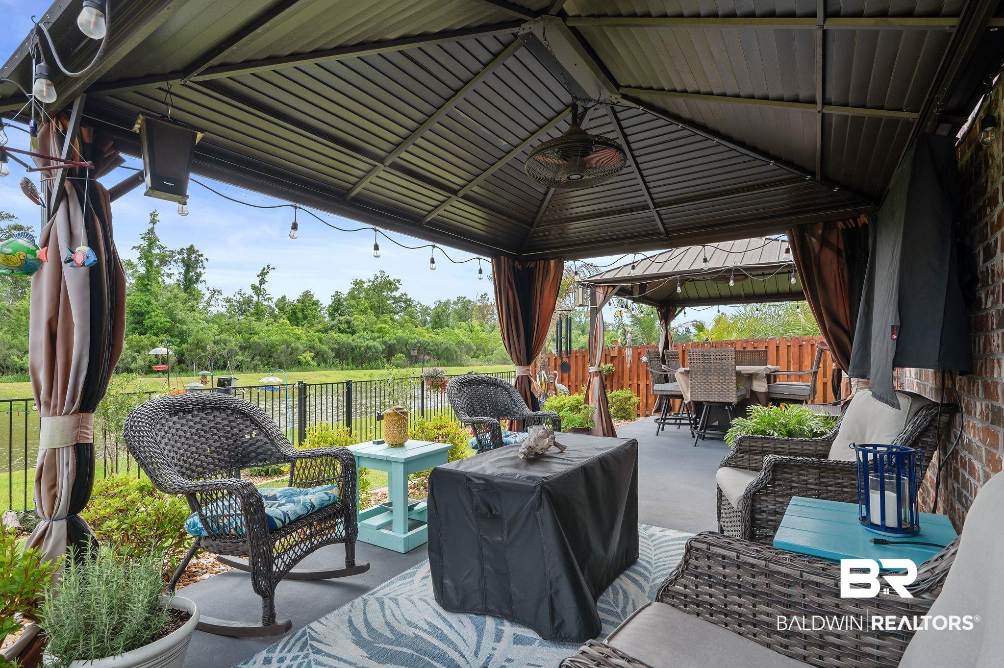 1165 Stella Road Foley, AL 36535 - Photo 31 of 42 View of patio / terrace with a gazebo, a fenced backyard, and outdoor lounge area