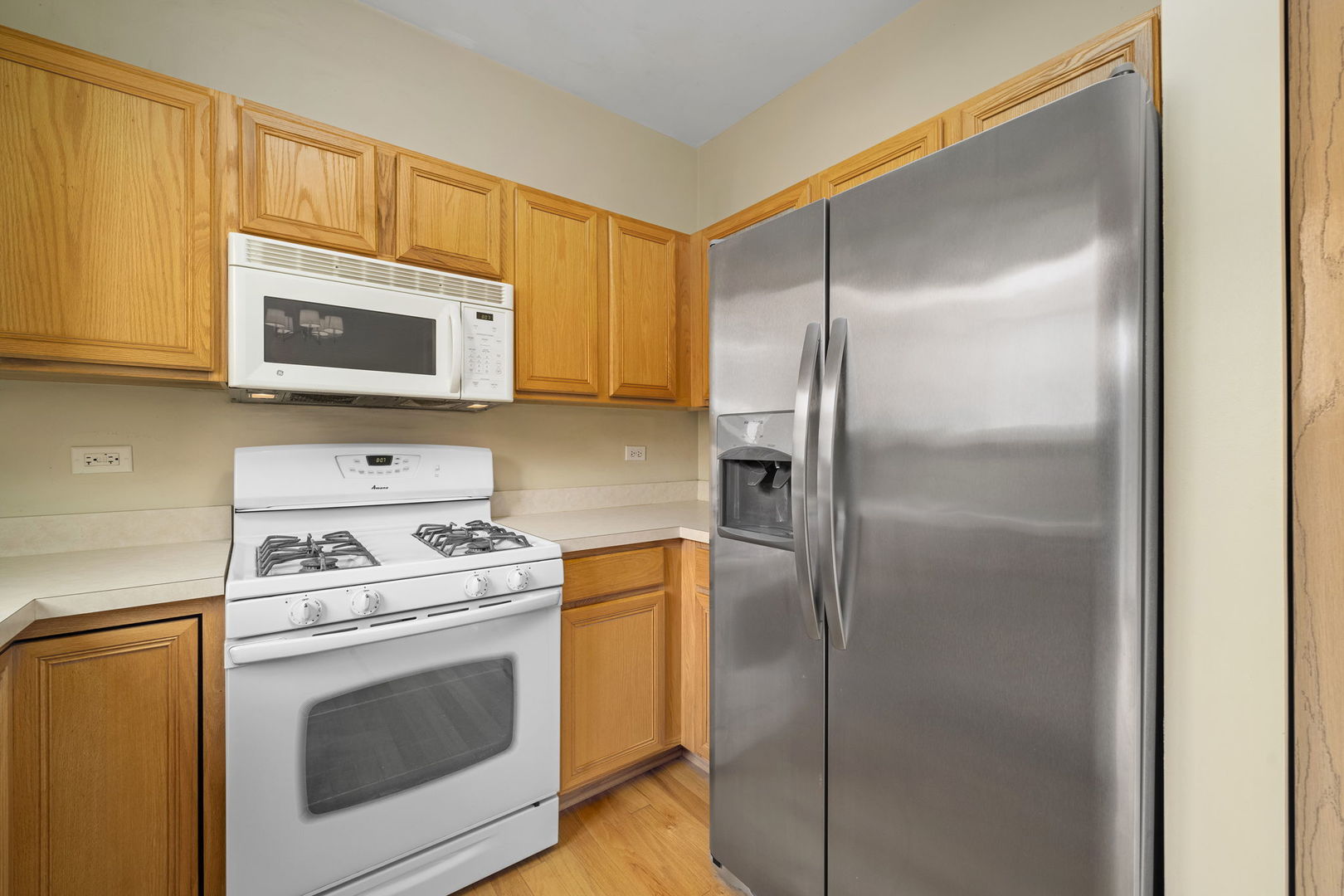1784 Fieldstone Drive North Shorewood, IL 60404 - Photo 11 of 24 a kitchen with a stove microwave and refrigerator