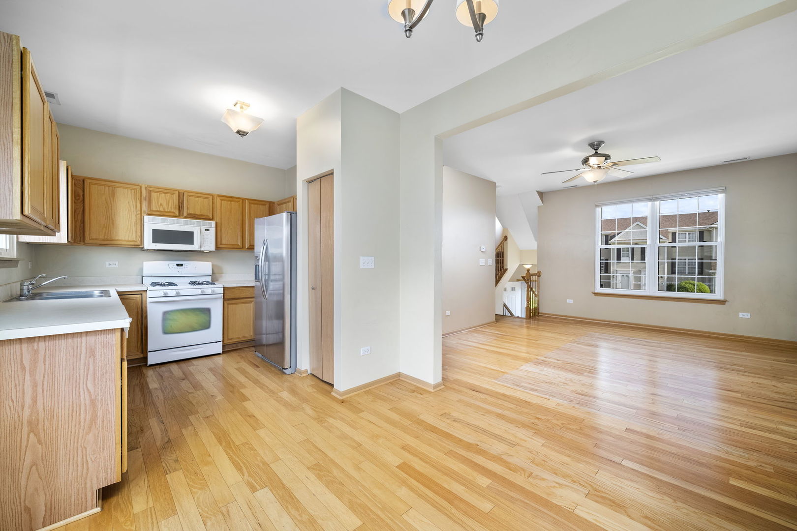1784 Fieldstone Drive North Shorewood, IL 60404 - Photo 13 of 24 a view of a kitchen with a sink dishwasher and a refrigerator