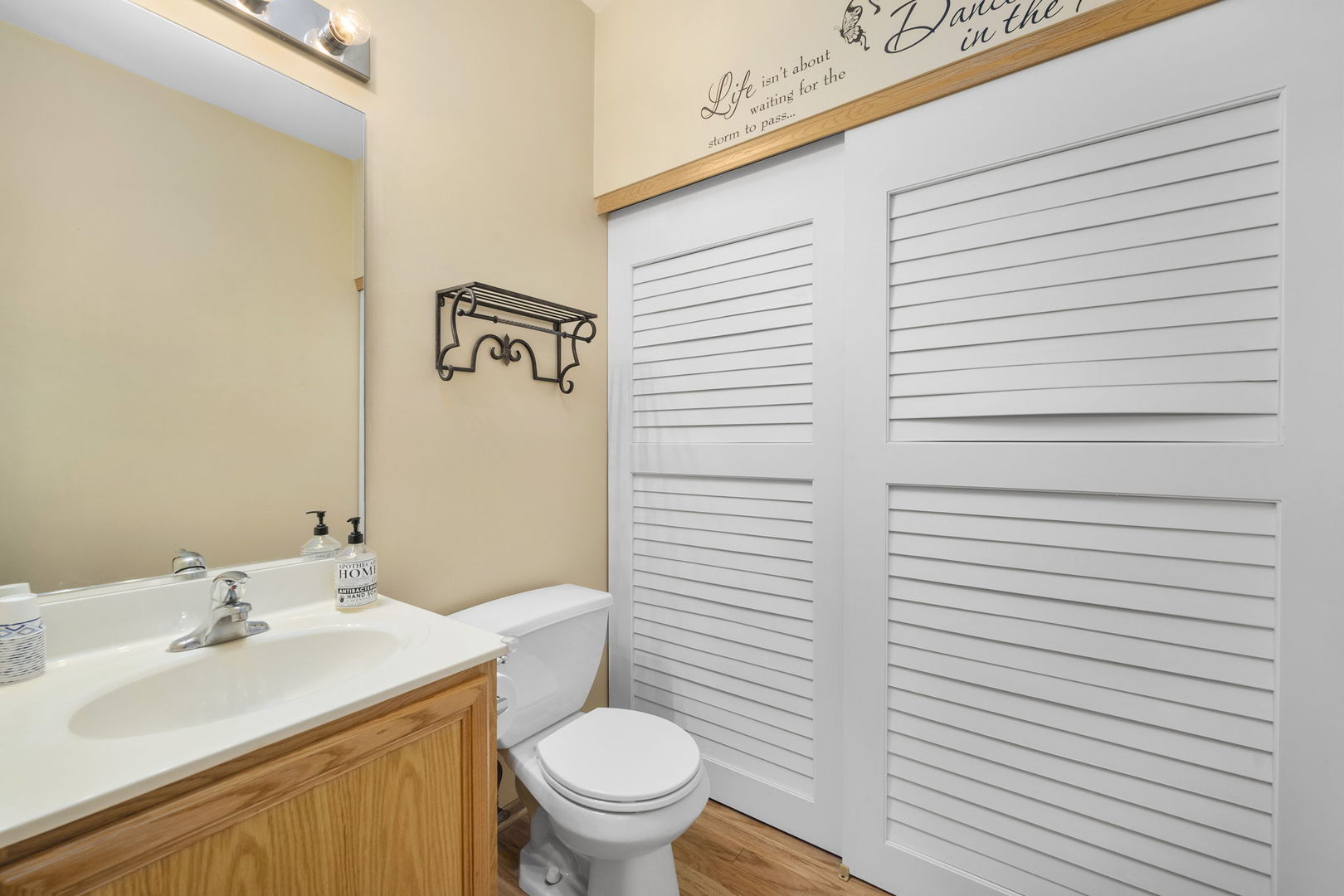 1784 Fieldstone Drive North Shorewood, IL 60404 - Photo 14 of 24 a bathroom with a sink a toilet and mirror