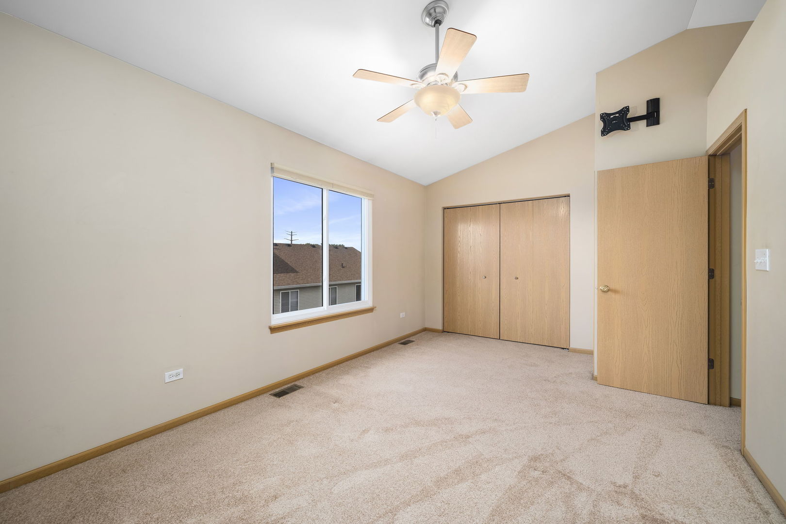 1784 Fieldstone Drive North Shorewood, IL 60404 - Photo 16 of 24 an empty room with windows and fan
