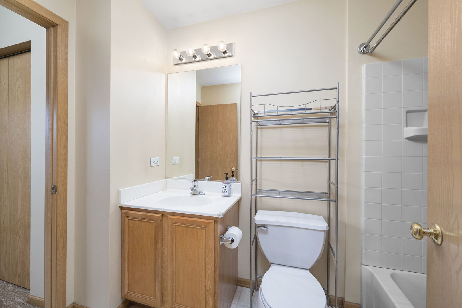 1784 Fieldstone Drive North Shorewood, IL 60404 - Photo 19 of 24 a bathroom with a toilet sink and mirror