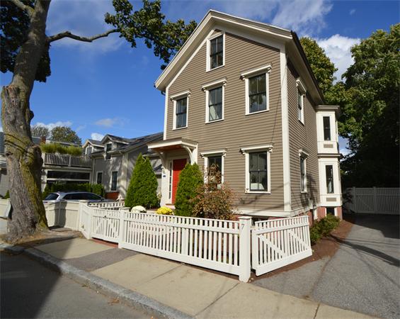 7 St Mary Road Cambridge, MA 02139 - Photo 1 of 24 a front view of a house with glass windows and a fence