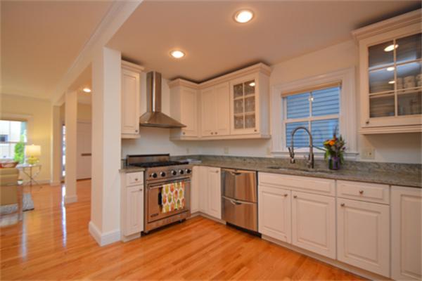 7 St Mary Road Cambridge, MA 02139 - Photo 11 of 24 a kitchen with granite countertop white cabinets and appliances