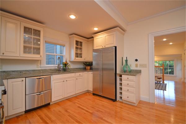 7 St Mary Road Cambridge, MA 02139 - Photo 12 of 24 a kitchen with stainless steel appliances granite countertop a refrigerator and cabinets