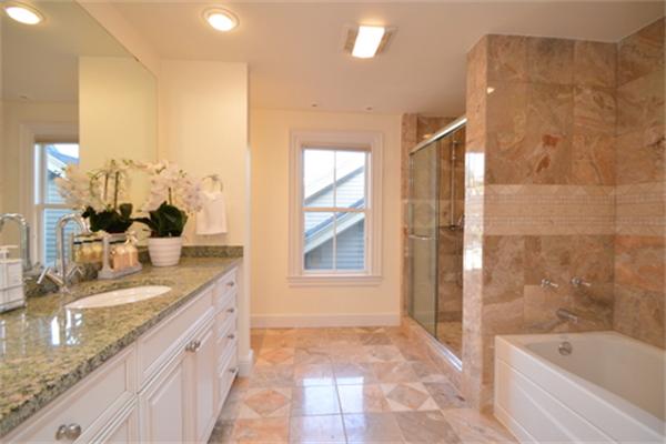 7 St Mary Road Cambridge, MA 02139 - Photo 18 of 24 a bathroom with a granite countertop sink a bathtub and a shower