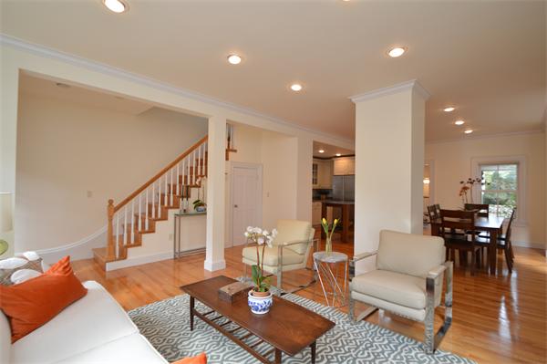 7 St Mary Road Cambridge, MA 02139 - Photo 4 of 24 a living room with furniture a wooden floor and kitchen view