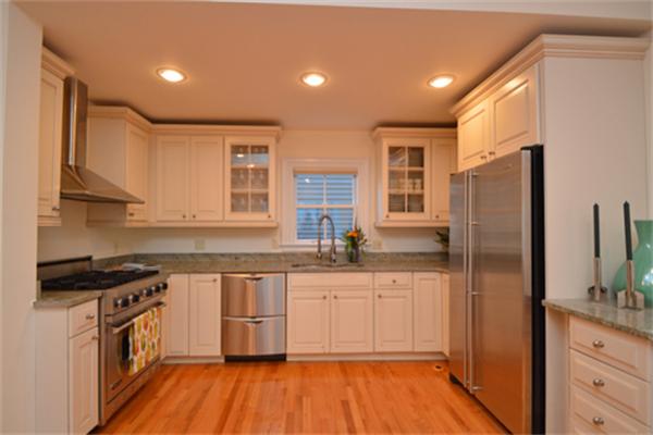 7 St Mary Road Cambridge, MA 02139 - Photo 10 of 24 a kitchen with stainless steel appliances granite countertop a stove a sink dishwasher and a refrigerator