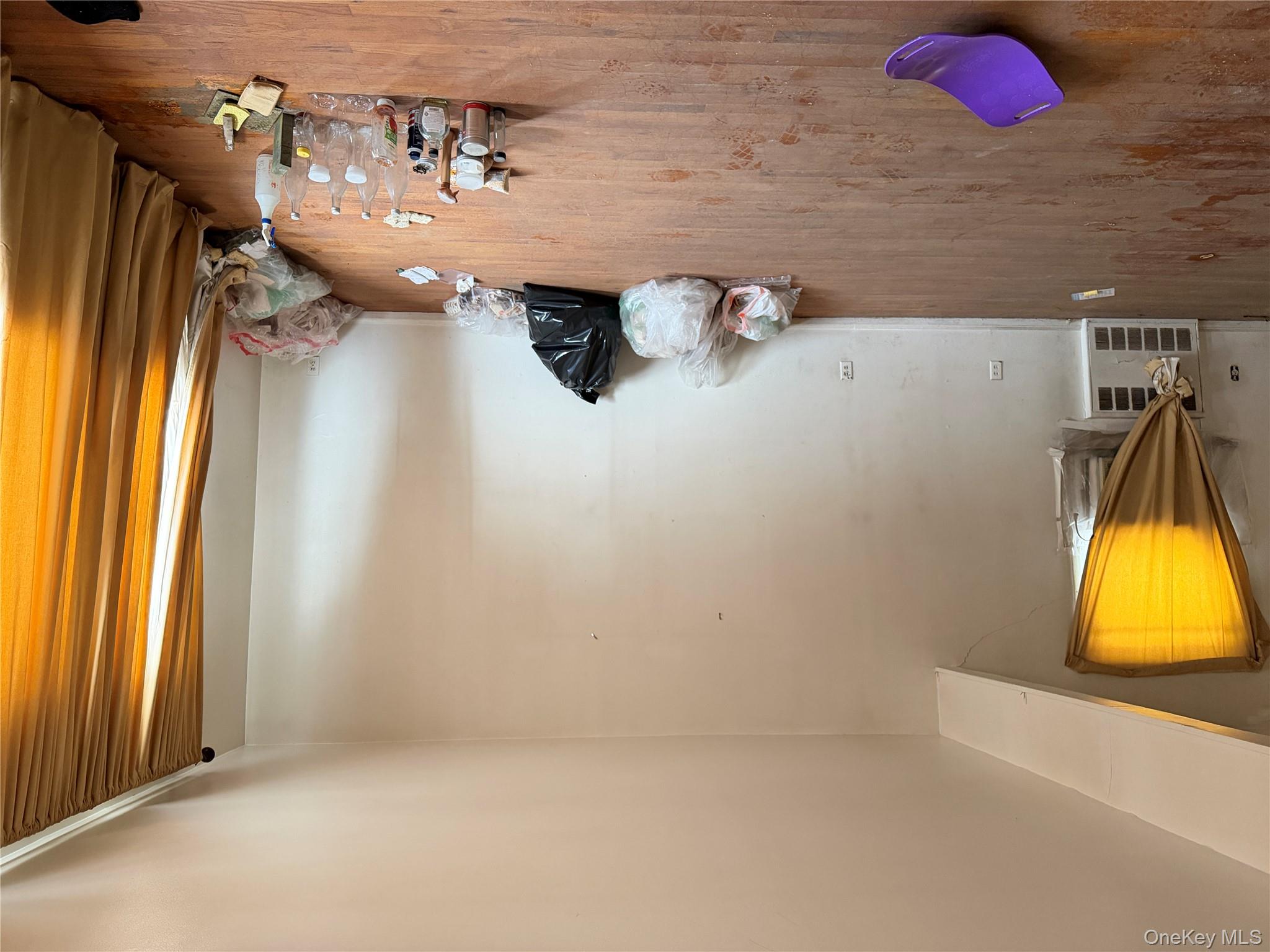 135-26 219th Street Queens, NY 11413 - Photo 14 of 43 a bedroom with a bed and a flat screen tv