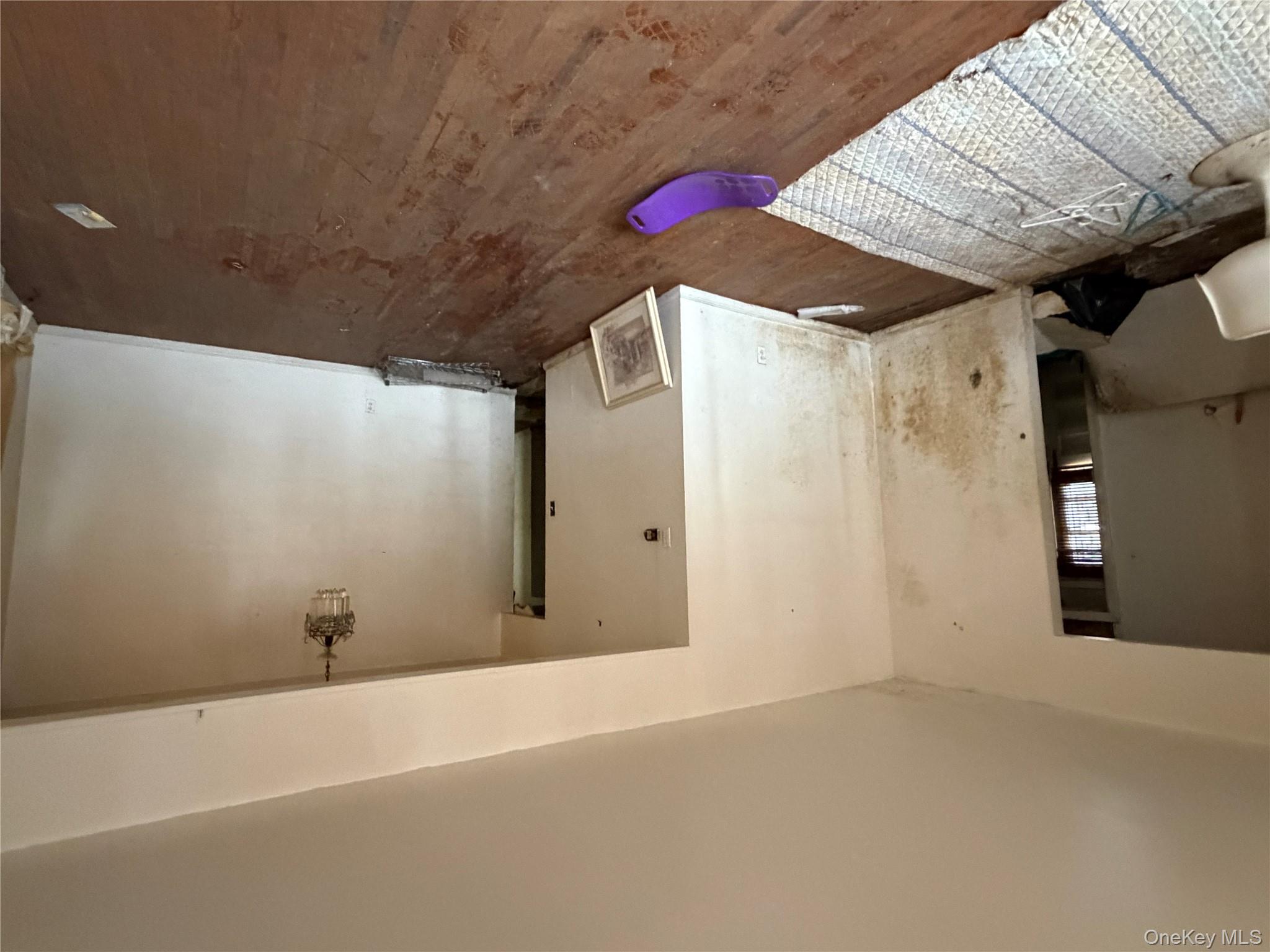 135-26 219th Street Queens, NY 11413 - Photo 17 of 43 a bedroom with a bed and a dresser