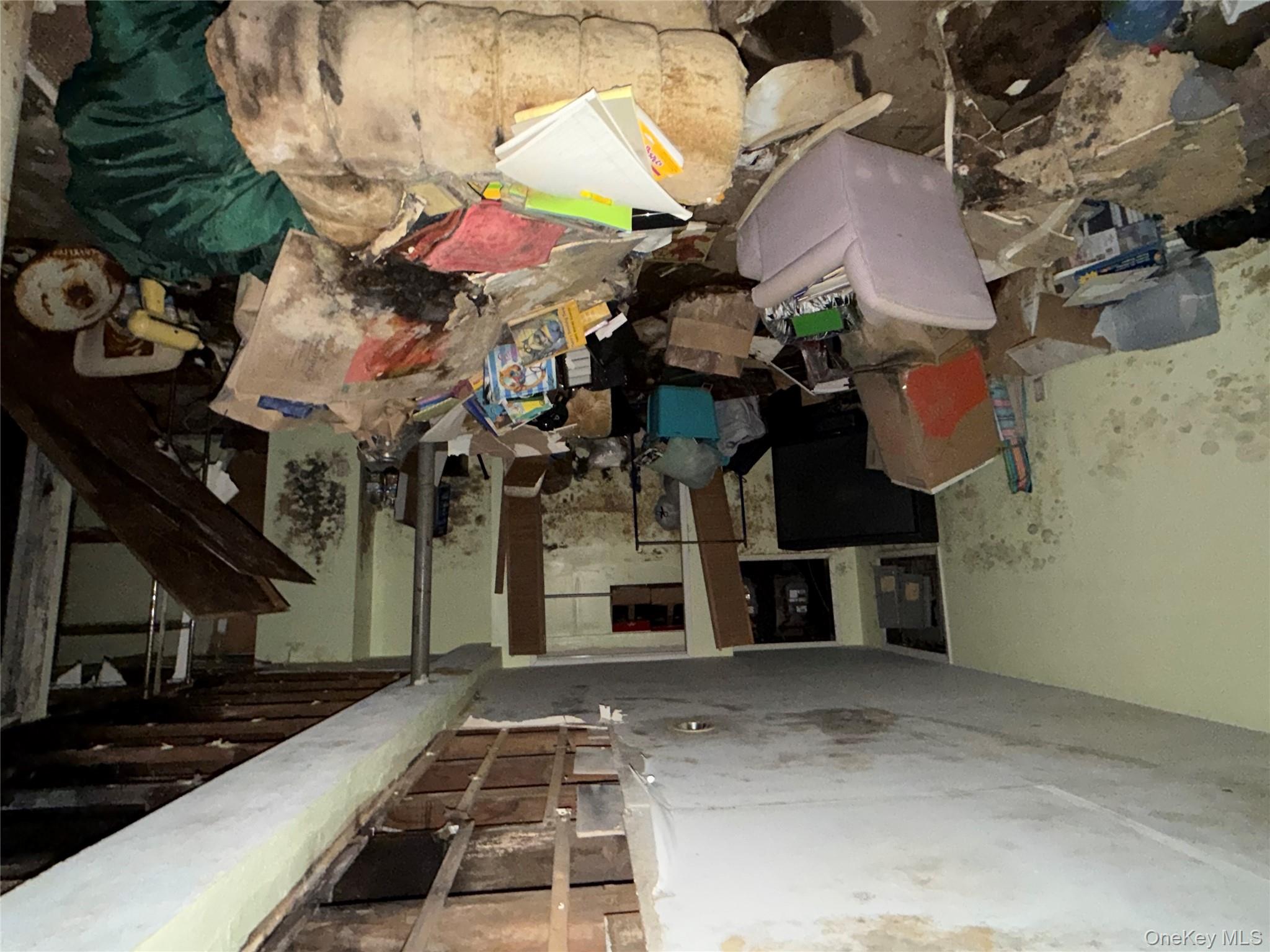 135-26 219th Street Queens, NY 11413 - Photo 25 of 43 a living room with furniture and a flat screen tv