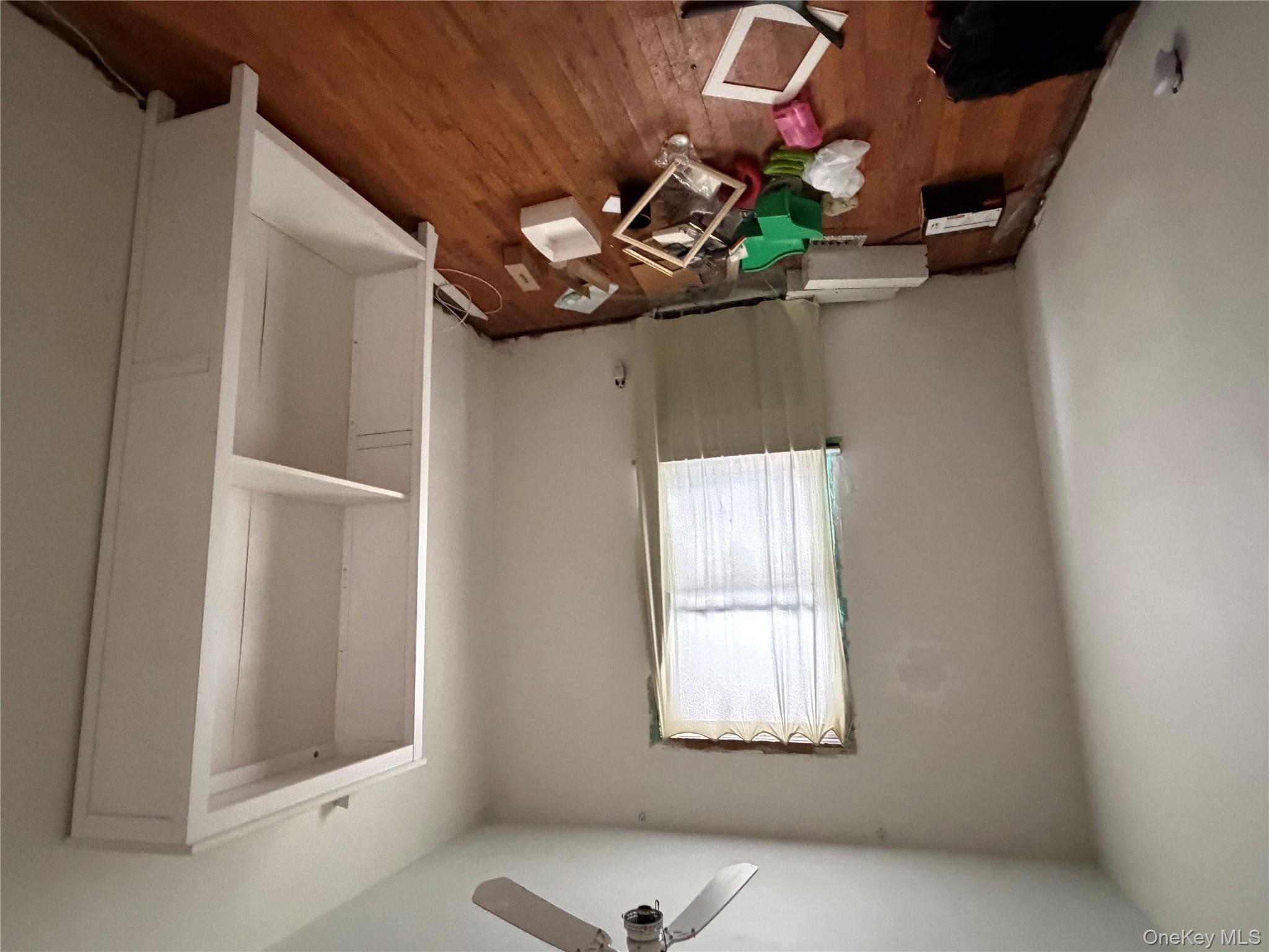 135-26 219th Street Queens, NY 11413 - Photo 28 of 43 an empty room with windows