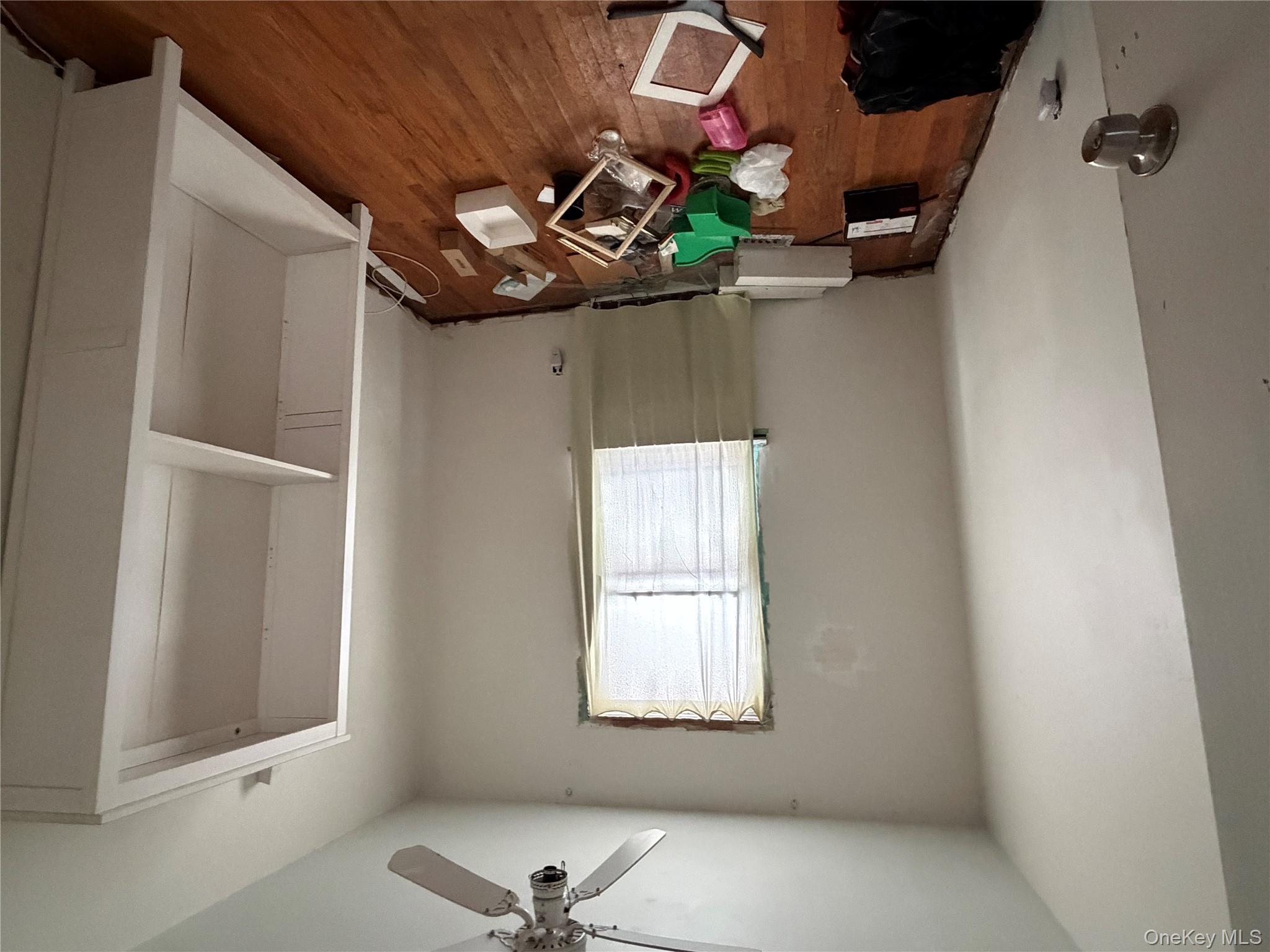 135-26 219th Street Queens, NY 11413 - Photo 29 of 43 a room with toys and wooden floor