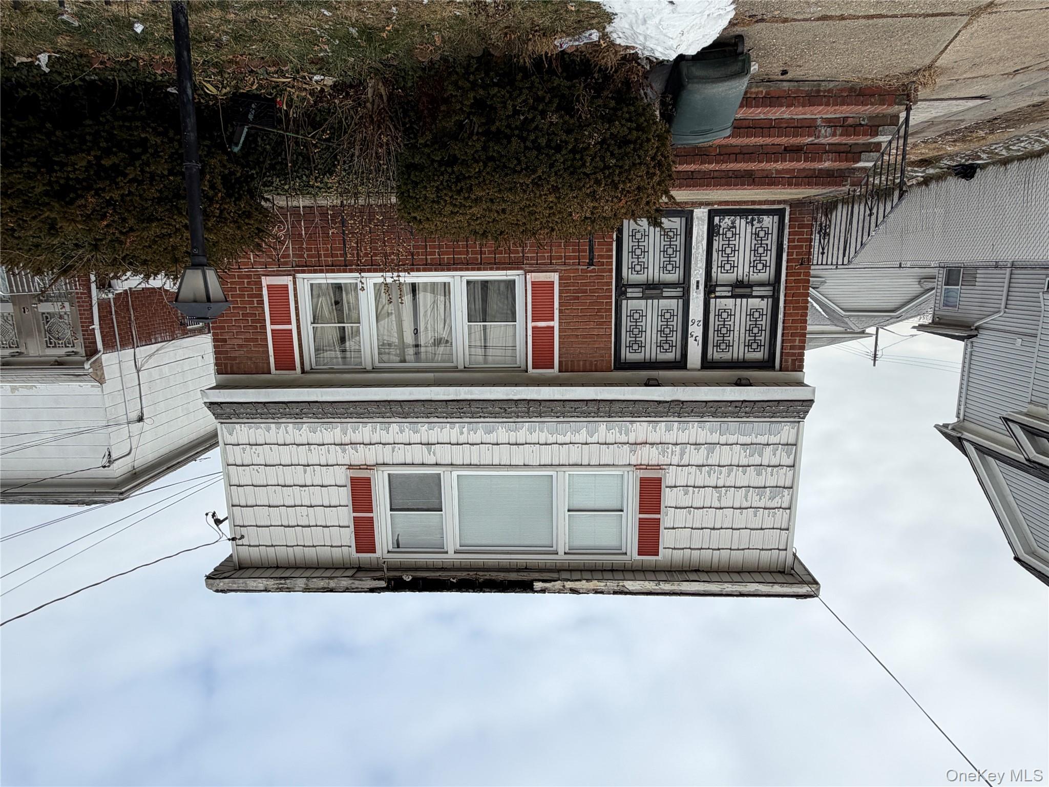 135-26 219th Street Queens, NY 11413 - Photo 3 of 43 a front view of a house with plants
