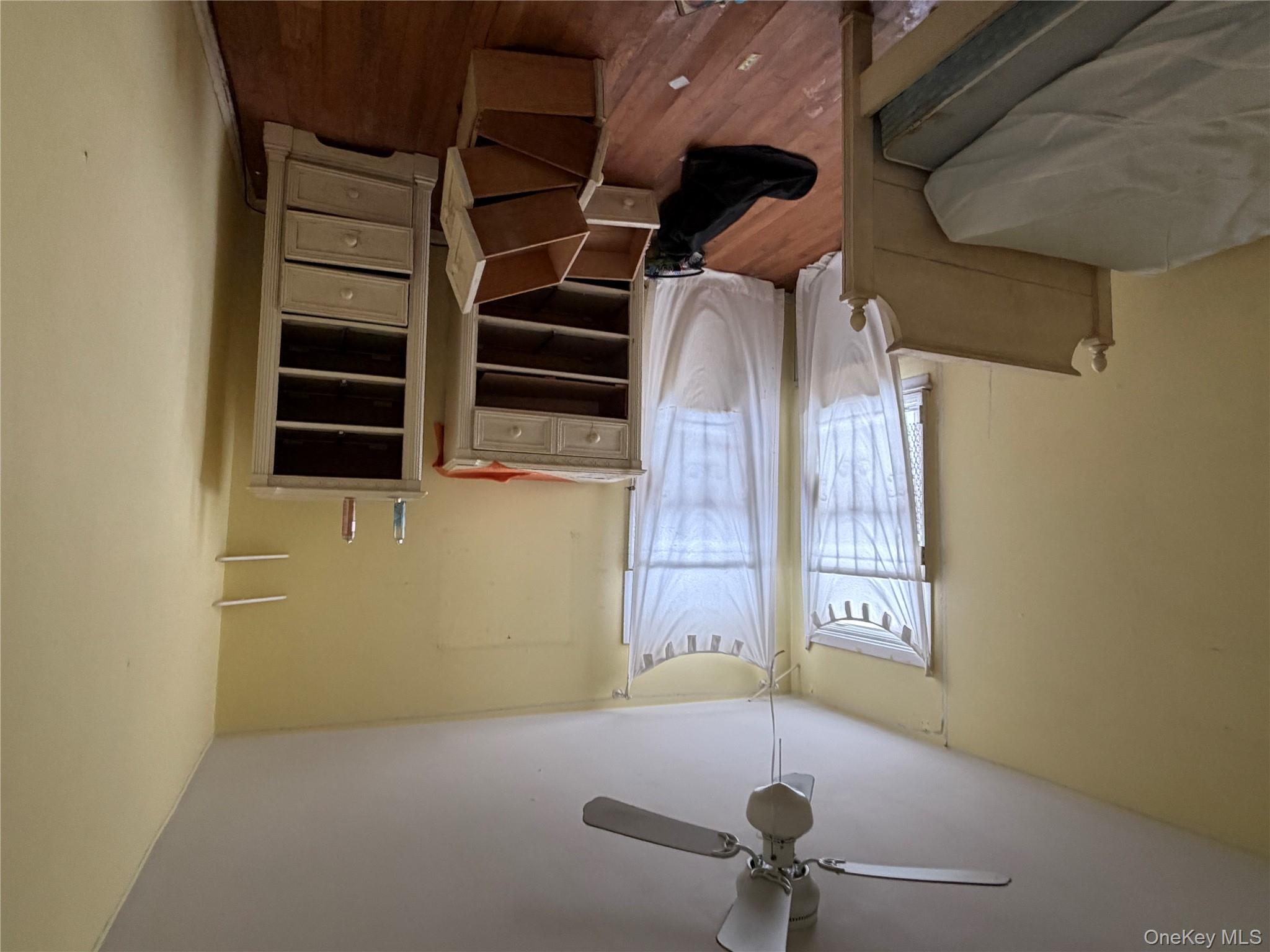 135-26 219th Street Queens, NY 11413 - Photo 32 of 43 a bedroom with furniture and a window