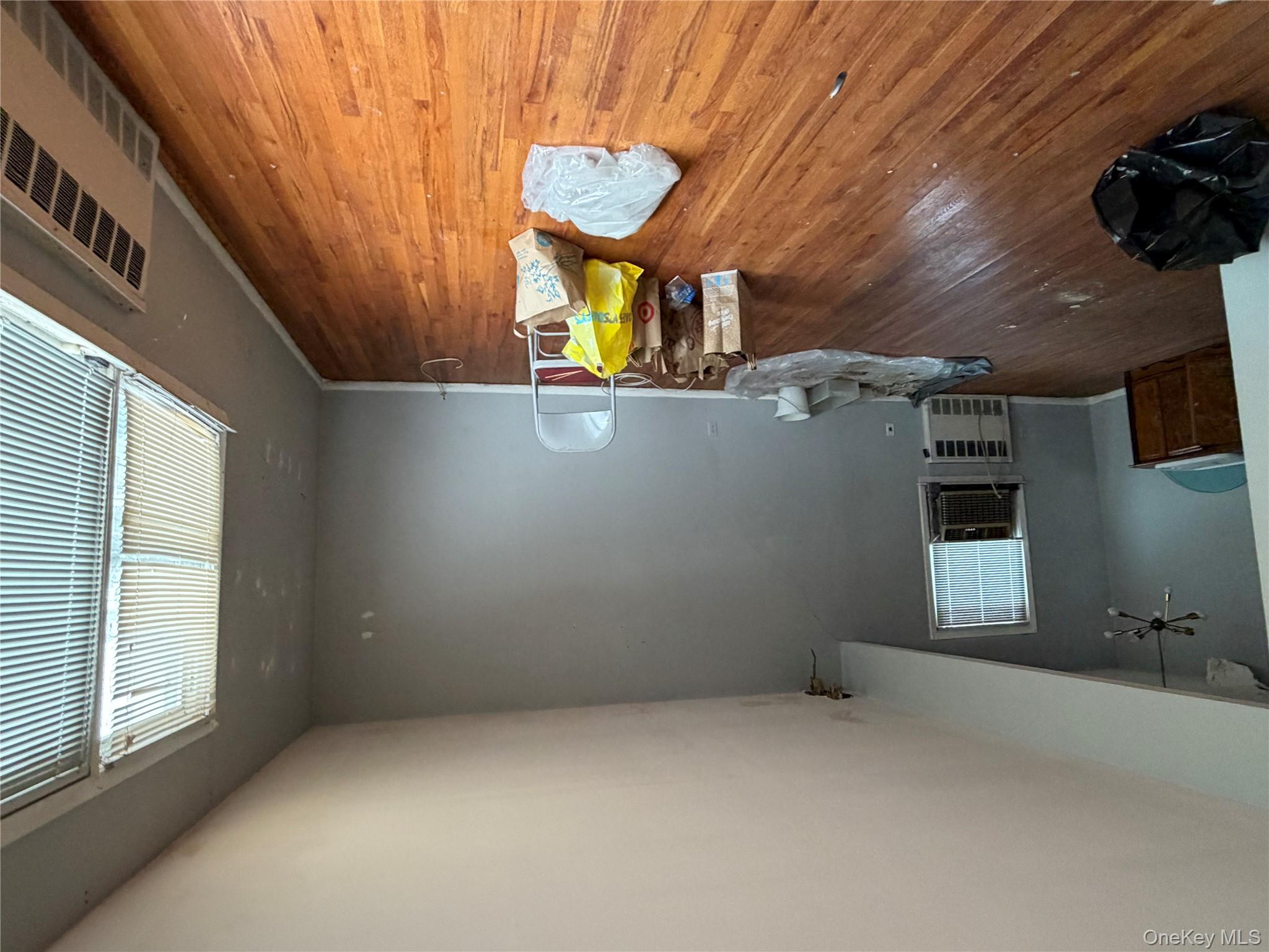 135-26 219th Street Queens, NY 11413 - Photo 36 of 43 a living room with furniture and a wooden floor