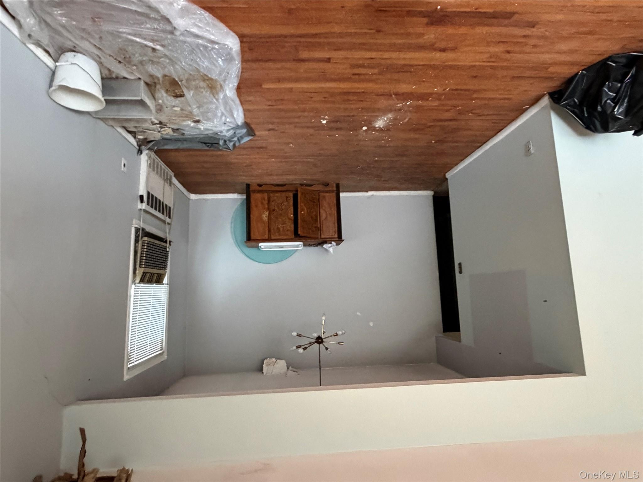 135-26 219th Street Queens, NY 11413 - Photo 37 of 43 a bedroom with a bed and a view of bathroom