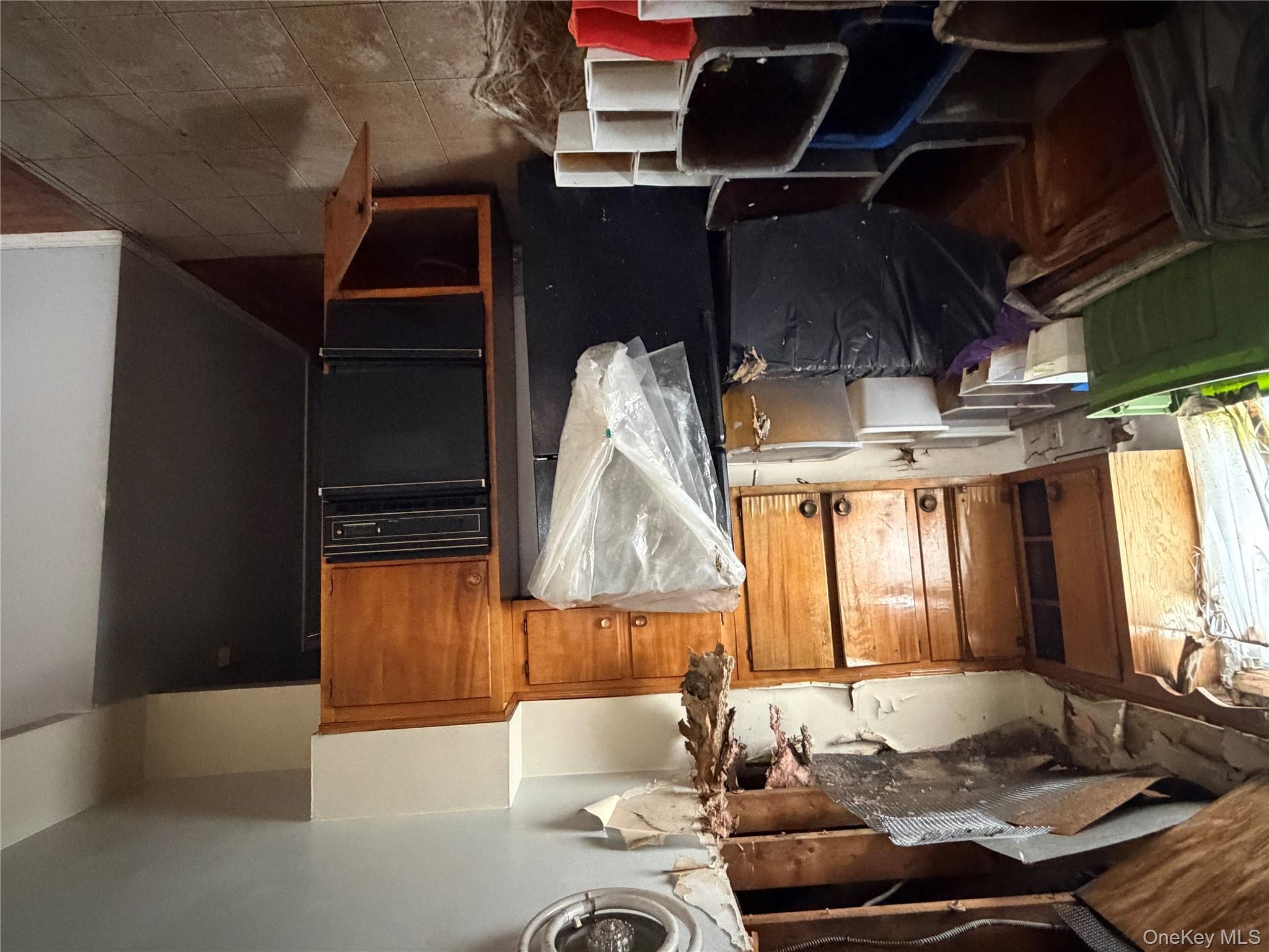 135-26 219th Street Queens, NY 11413 - Photo 39 of 43 a room with furniture and window