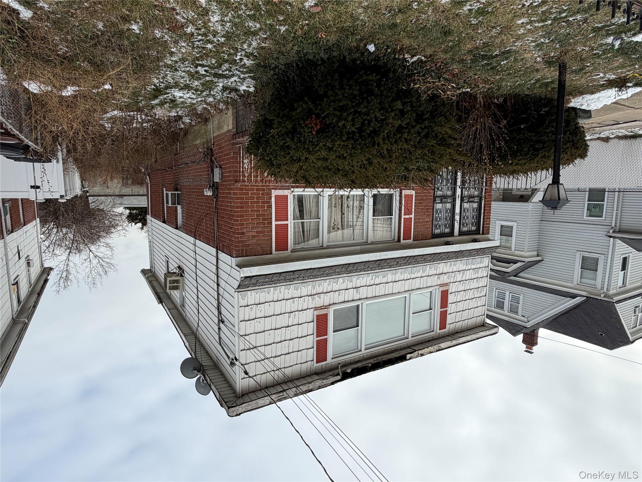 135-26 219th Street Queens, NY 11413 - Photo 4 of 43 a front view of a house with a yard