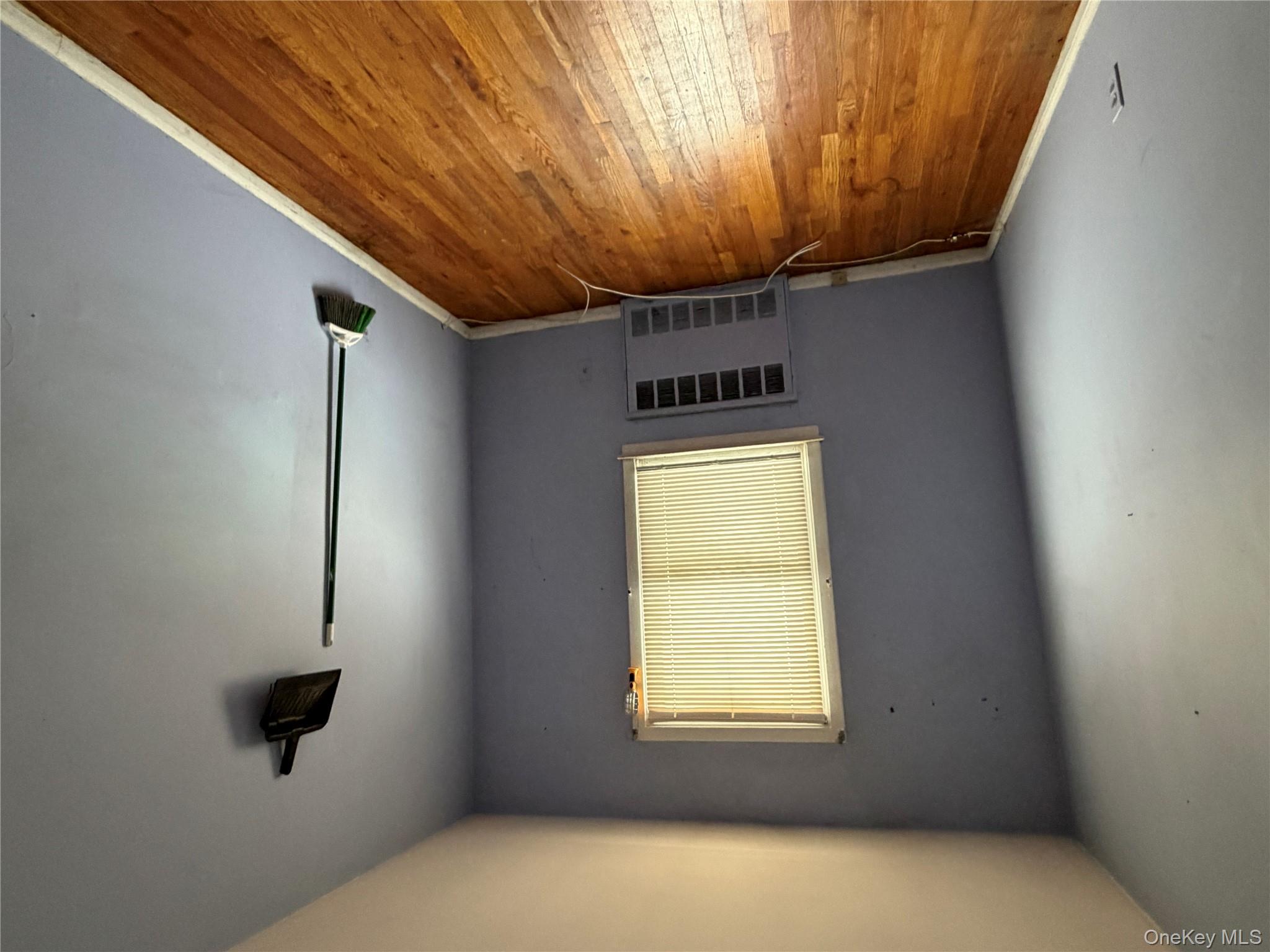 135-26 219th Street Queens, NY 11413 - Photo 42 of 43 an empty room with a window