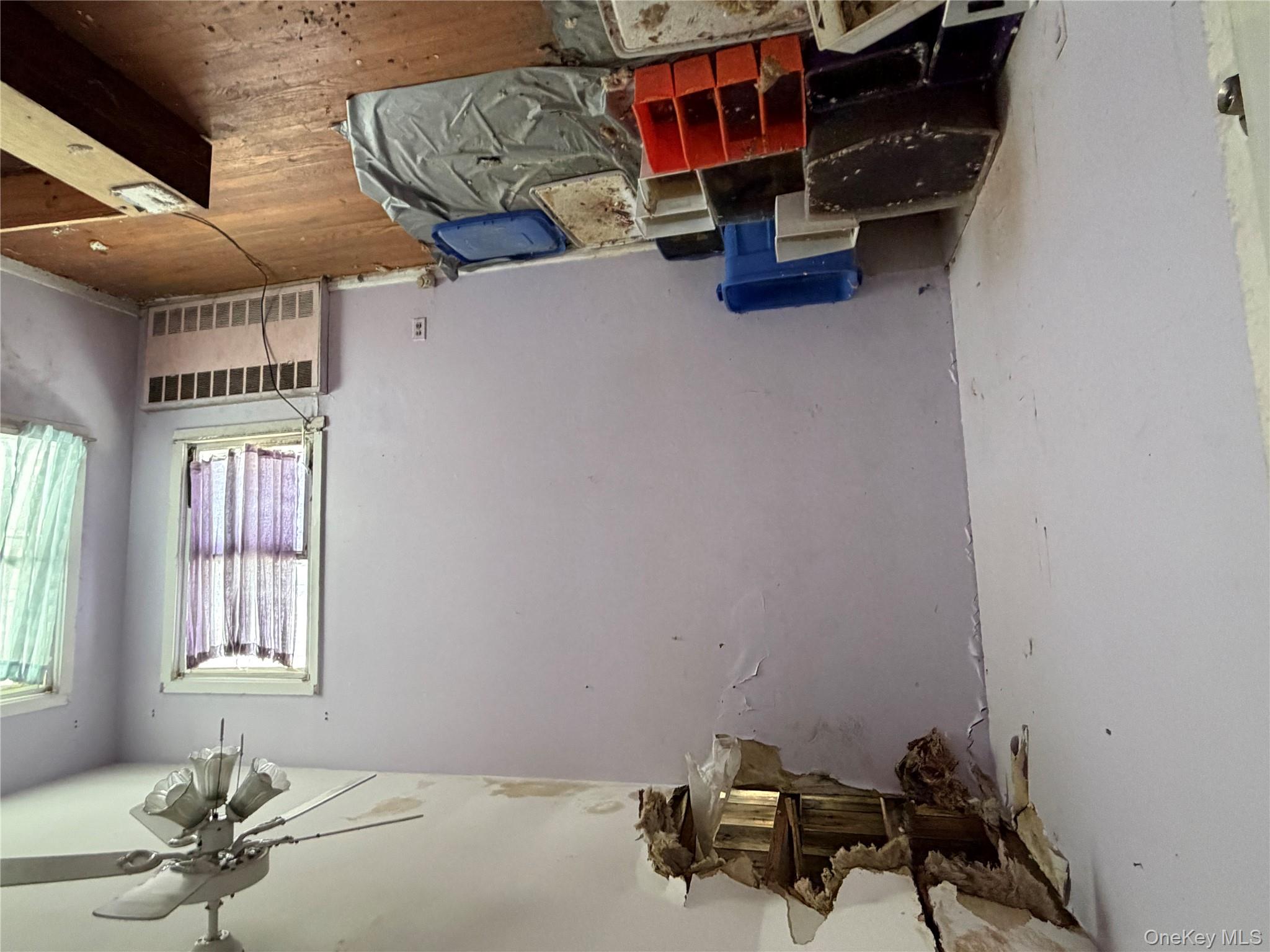 135-26 219th Street Queens, NY 11413 - Photo 43 of 43 a bedroom with bed and window