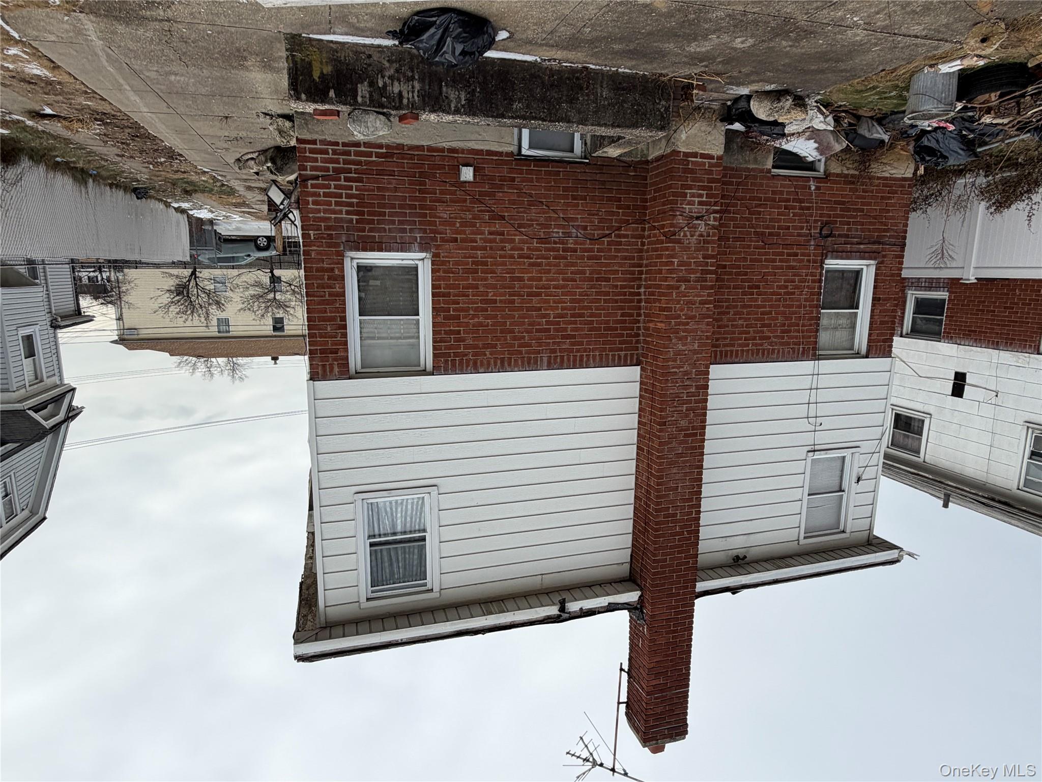 135-26 219th Street Queens, NY 11413 - Photo 8 of 43 a front view of a house with parking area