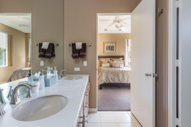 a en suite bathroom with a sink and a mirror