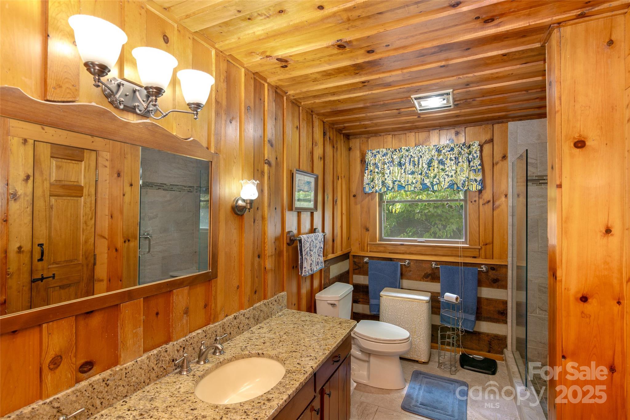 83 Daybreak Ridge Sylva, NC 28779 - Photo 20 of 40 a bathroom with a granite countertop sink toilet and shower
