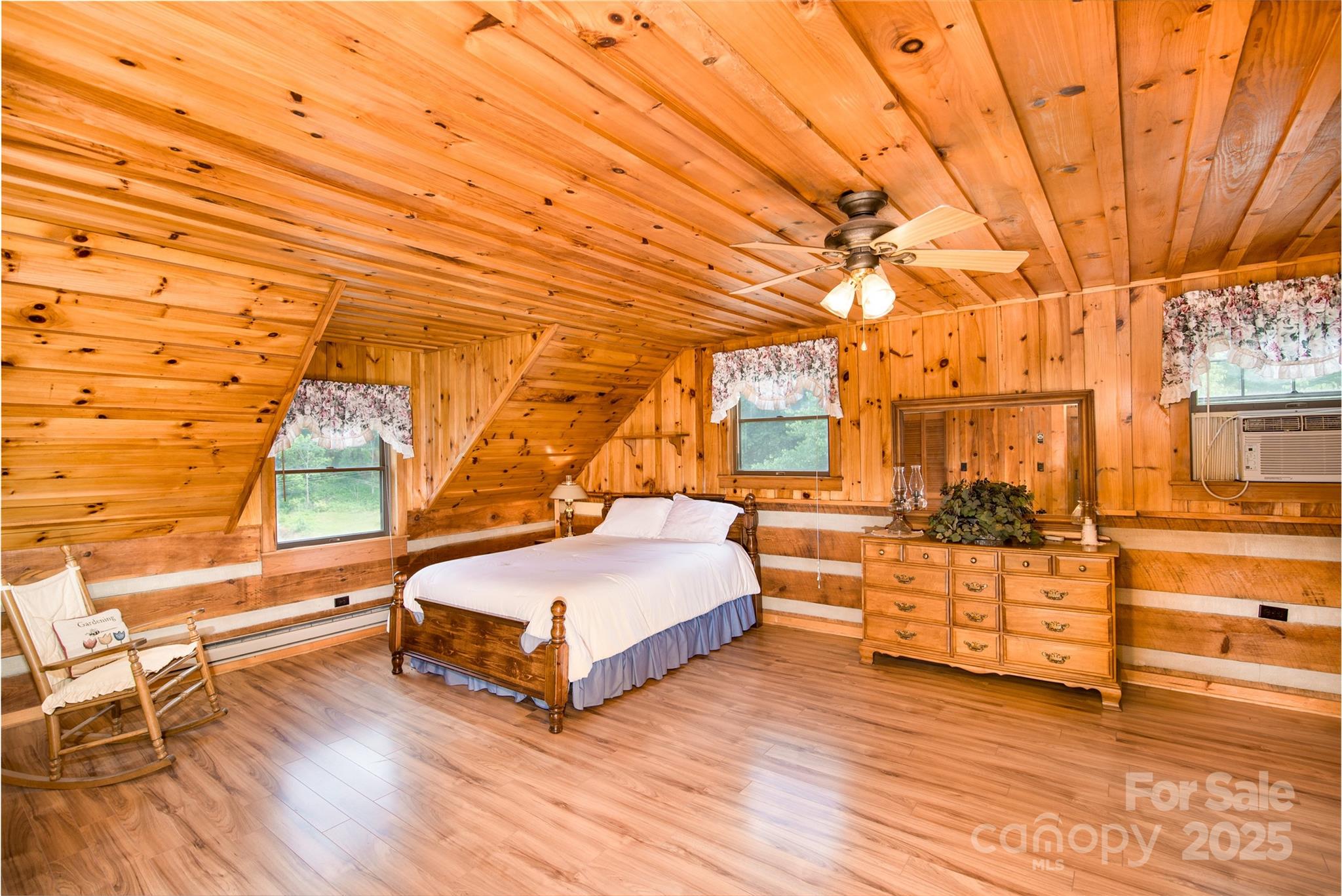 83 Daybreak Ridge Sylva, NC 28779 - Photo 21 of 40 a spacious bedroom with a bed and a window