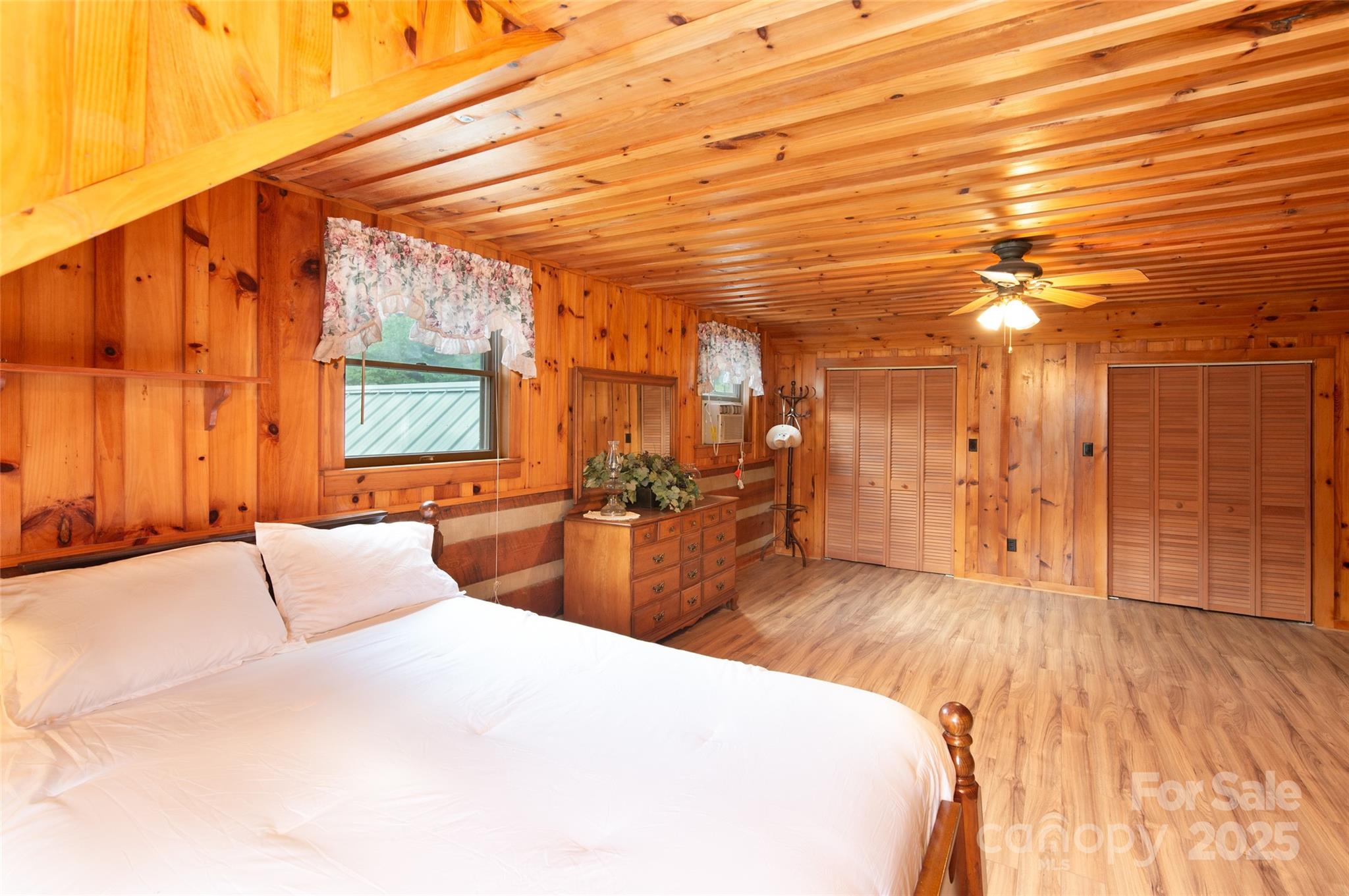 83 Daybreak Ridge Sylva, NC 28779 - Photo 22 of 40 a large bedroom with wooden floor and large window