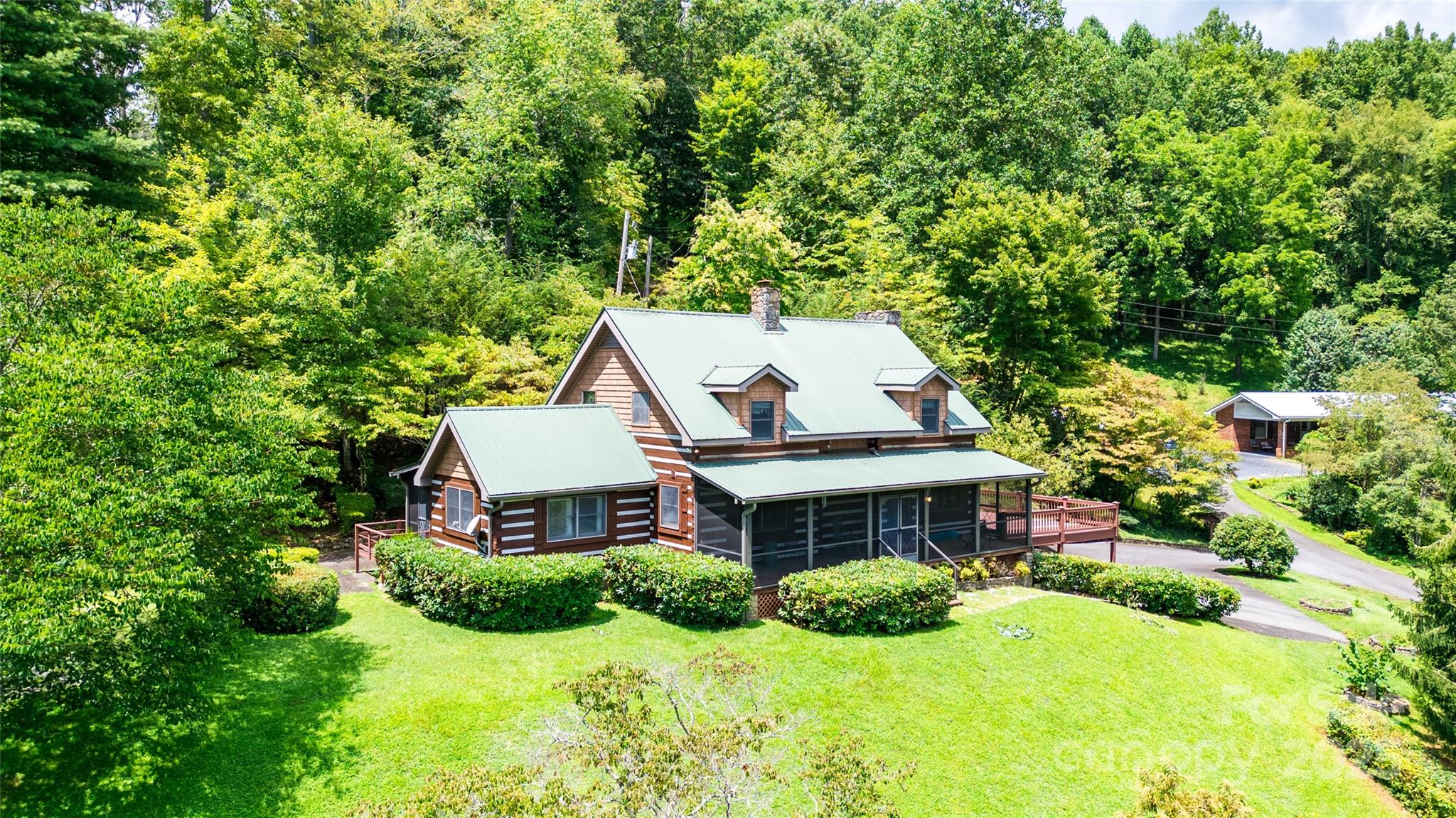 83 Daybreak Ridge Sylva, NC 28779 - Photo 34 of 40 a aerial view of a house with yard and green space