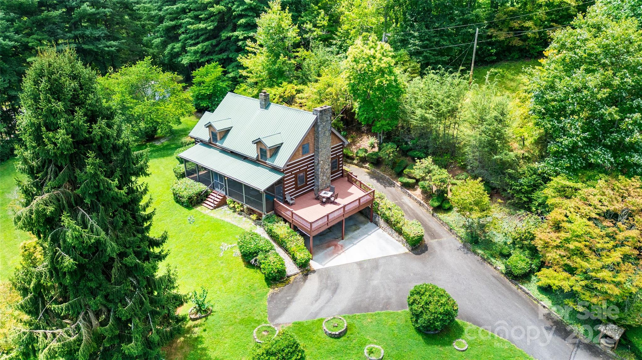 83 Daybreak Ridge Sylva, NC 28779 - Photo 40 of 40 an aerial view of a house with a garden