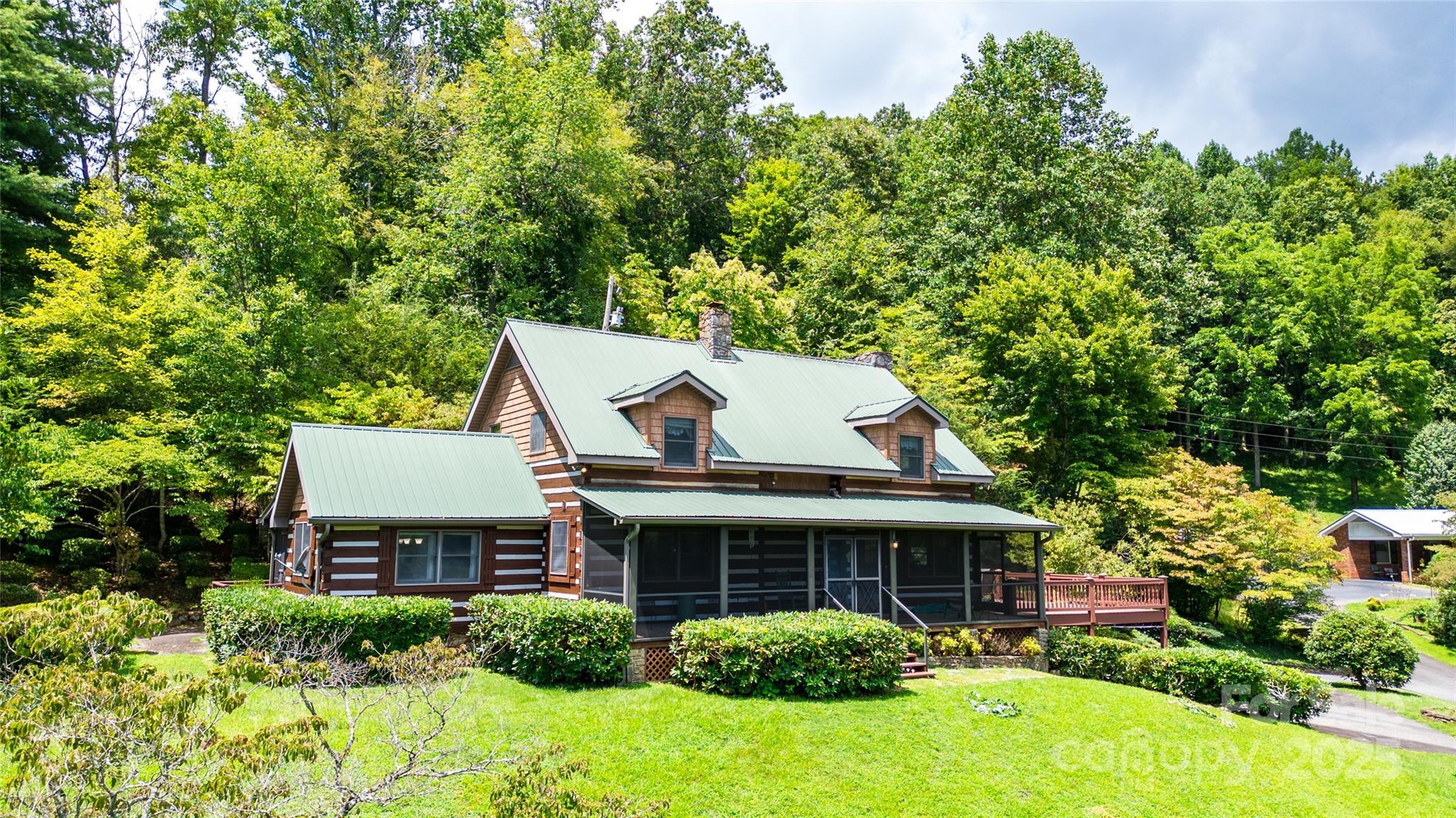 83 Daybreak Ridge Sylva, NC 28779 - Photo 4 of 40 a view of a house with a yard and potted plants