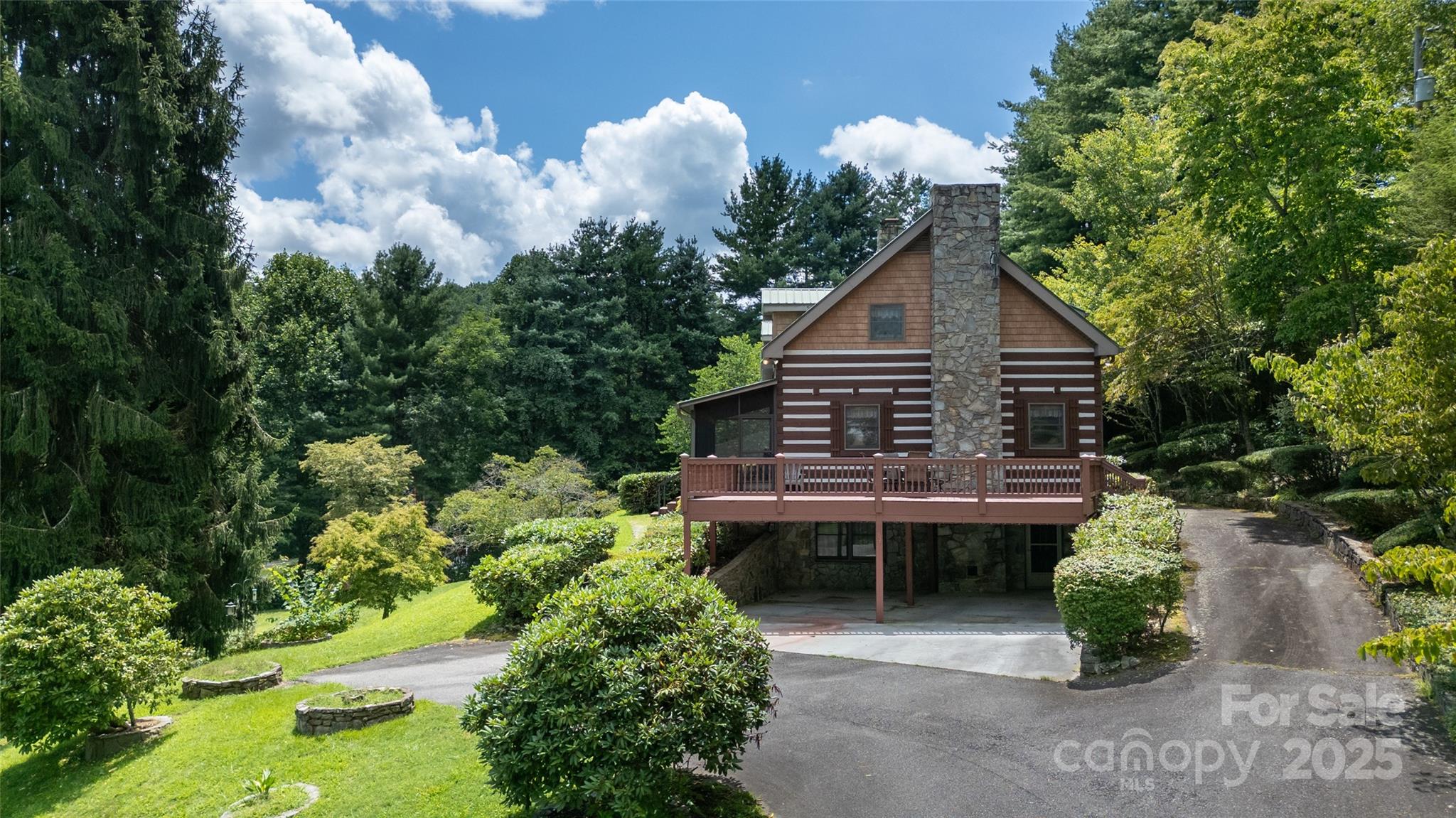 83 Daybreak Ridge Sylva, NC 28779 - Photo 5 of 40 a house view with a garden space