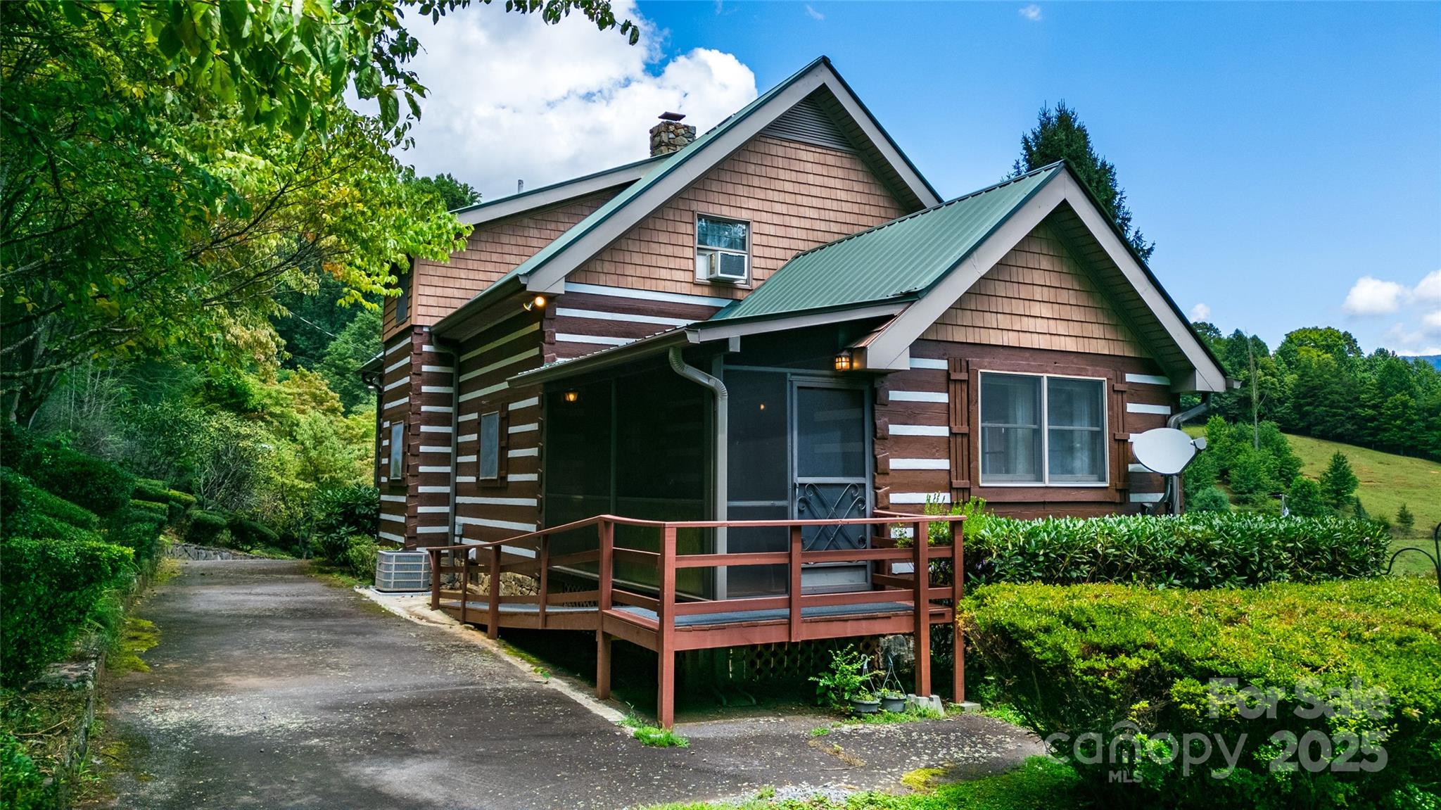 83 Daybreak Ridge Sylva, NC 28779 - Photo 6 of 40 a front view of a house with garage