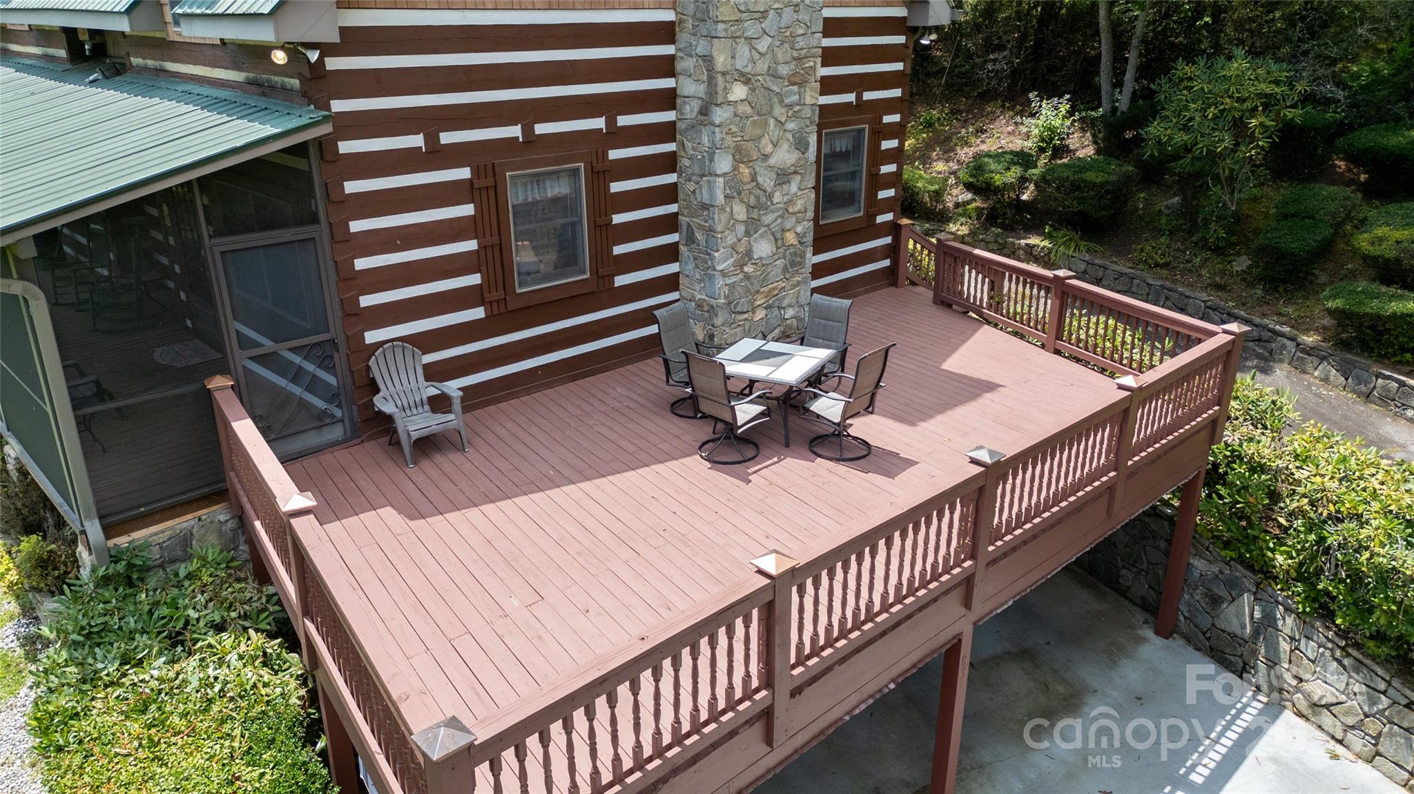 83 Daybreak Ridge Sylva, NC 28779 - Photo 7 of 40 a view of backyard with a deck and wooden floor
