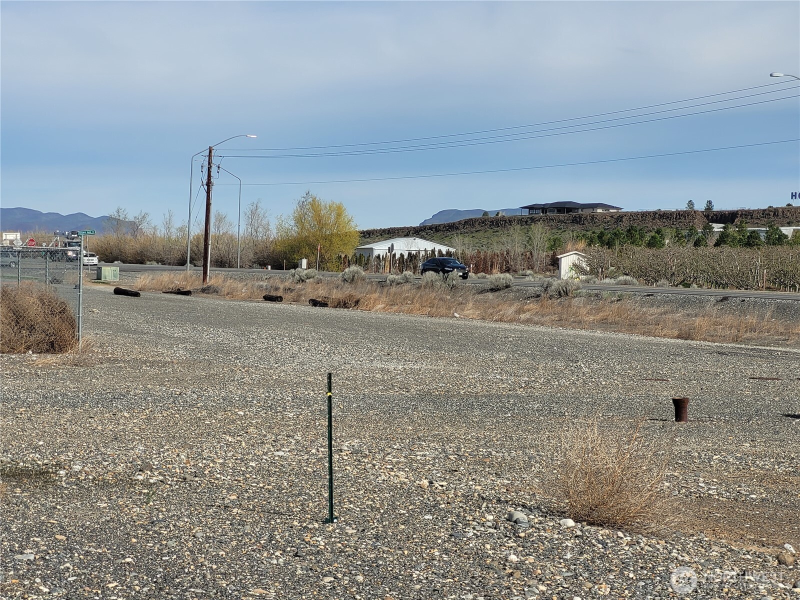 608 Poplar Way Mattawa, WA 99349 - Photo 3 of 4 a view of a dry yard with wooden fence