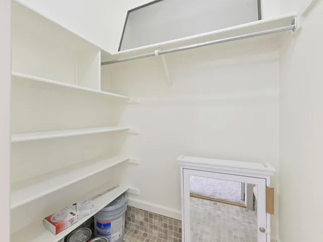 a view of an empty walk in closet