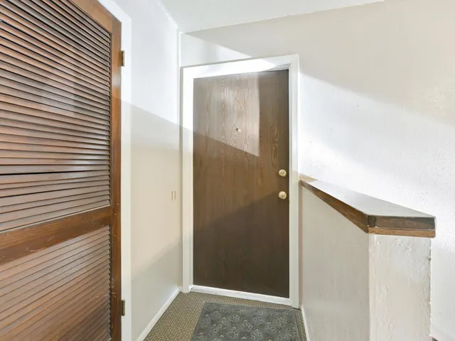 a view of roof deck with patio