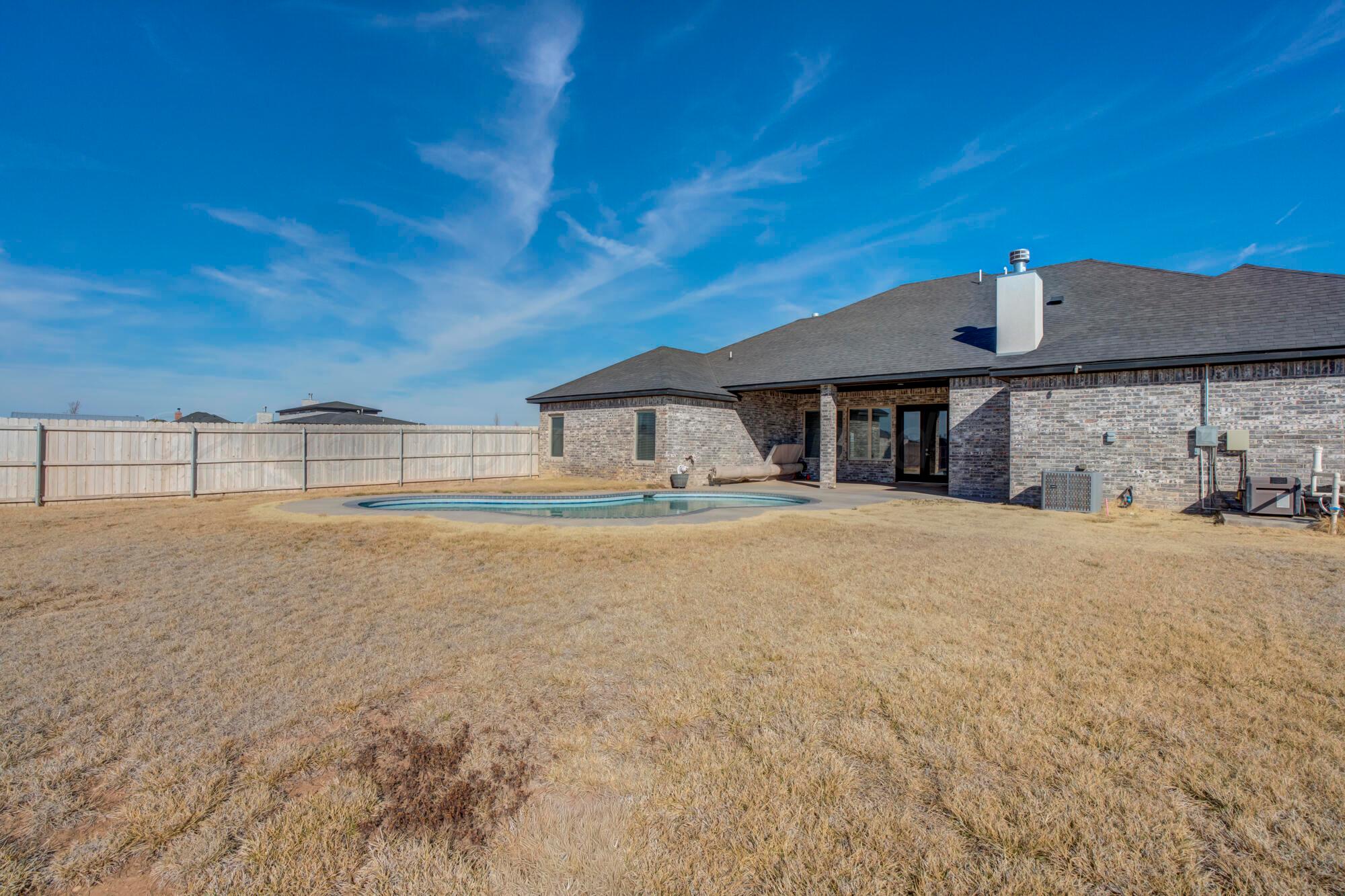 14310 Lobelia Place Amarillo, TX 79119 - Photo 63 of 78 a front view of a house with a big yard