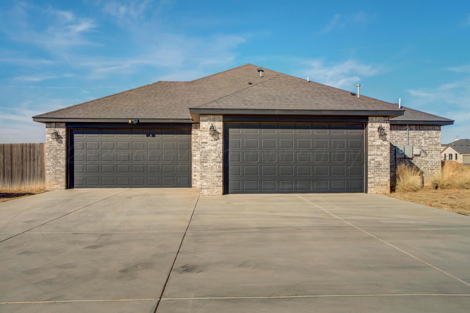 14310 Lobelia Place Amarillo, TX 79119 - Photo 7 of 78 a front view of a house with a yard and garage