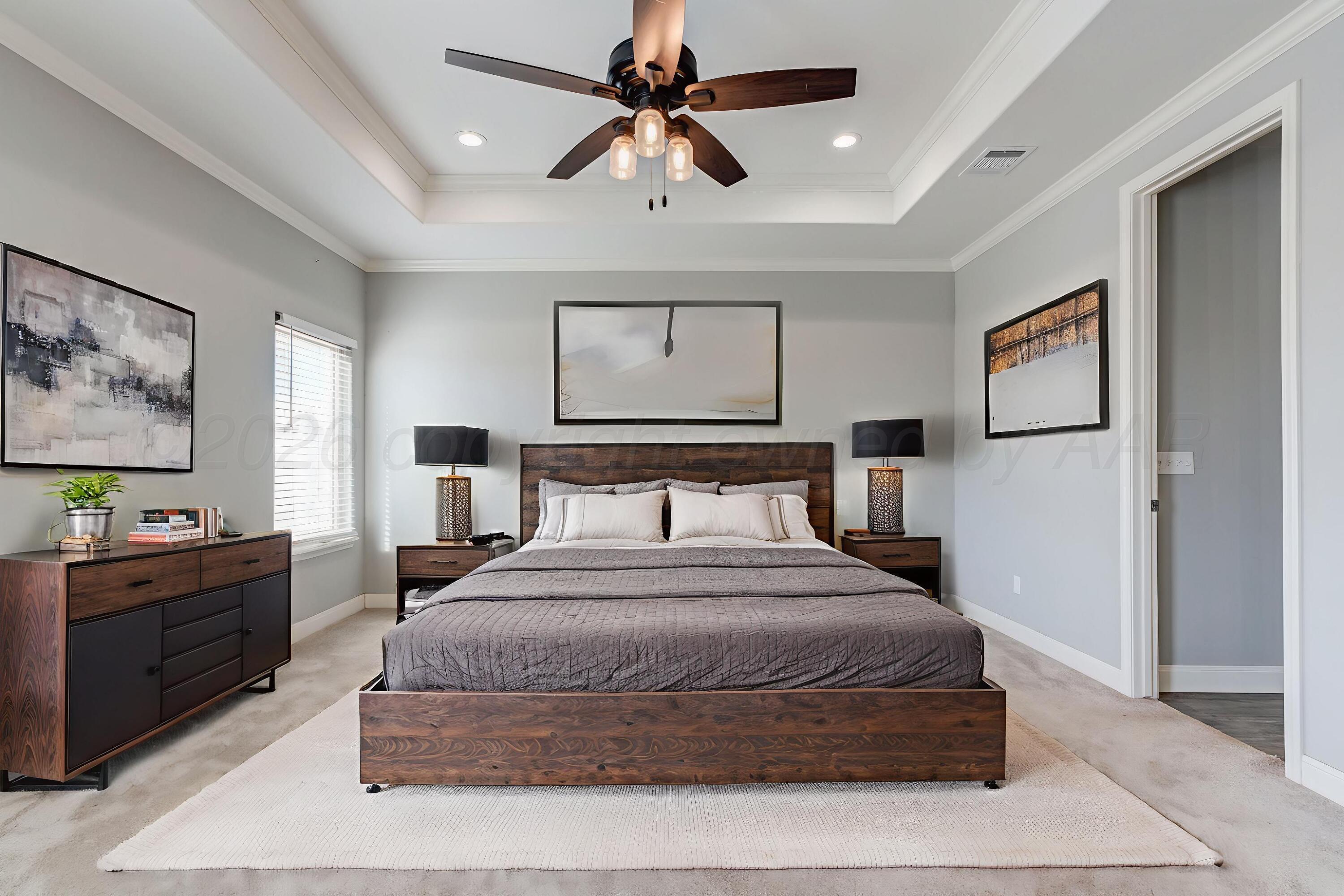 14310 Lobelia Place Amarillo, TX 79119 - Photo 73 of 78 a bedroom with a large bed and a chandelier