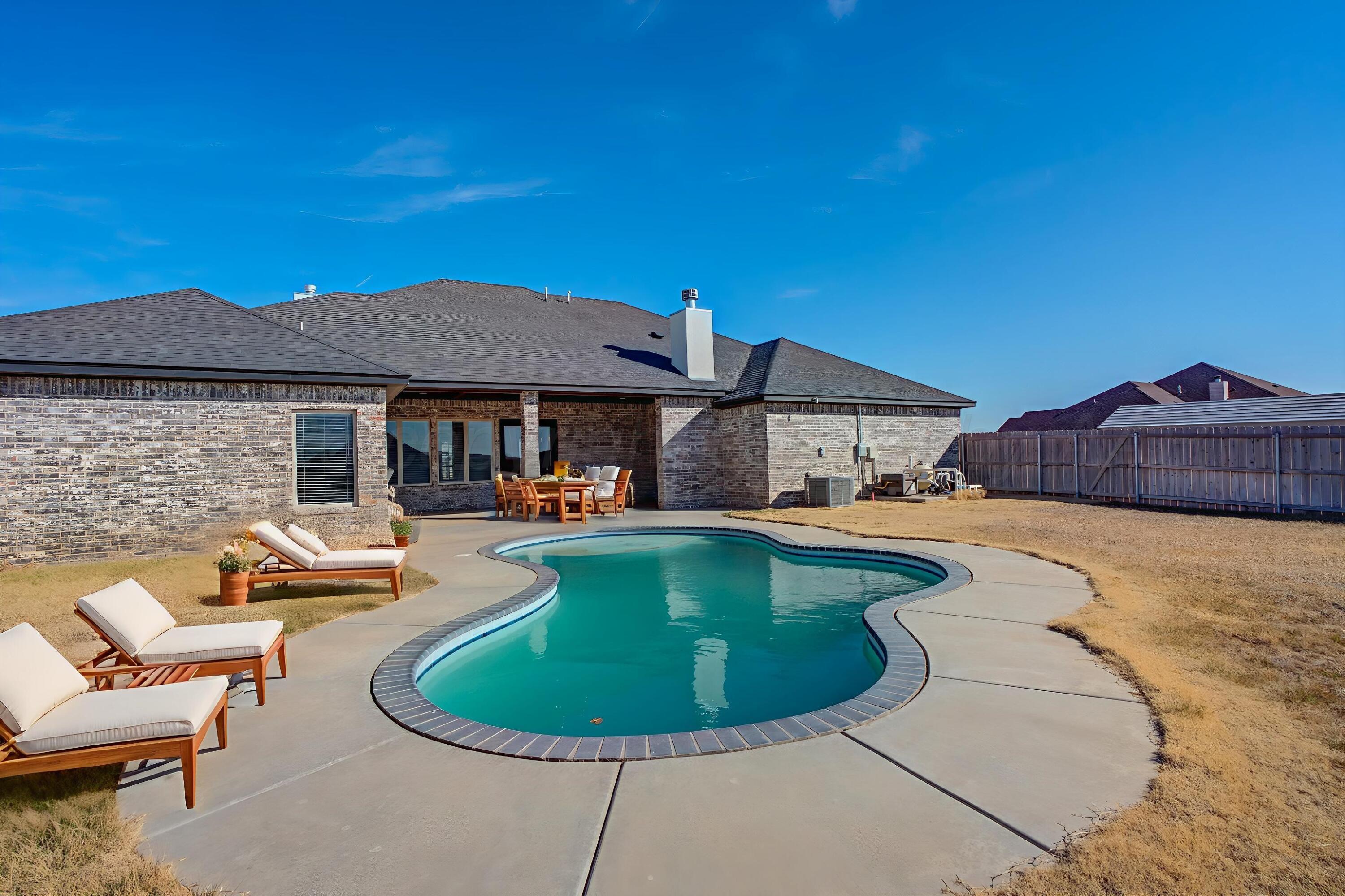 14310 Lobelia Place Amarillo, TX 79119 - Photo 78 of 78 a view of a house with swimming pool and sitting area