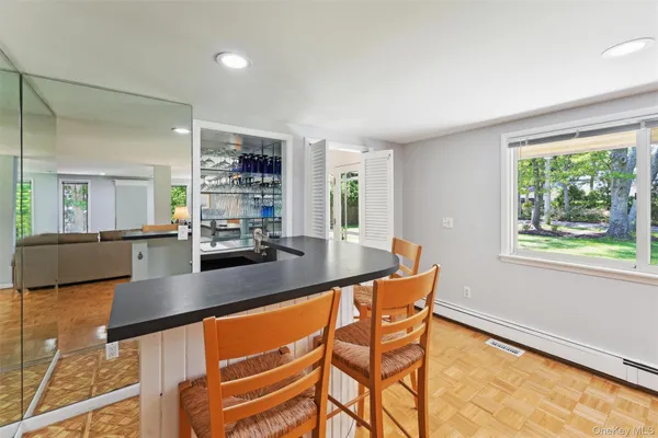 a kitchen with stainless steel appliances granite countertop a sink and a counter top space