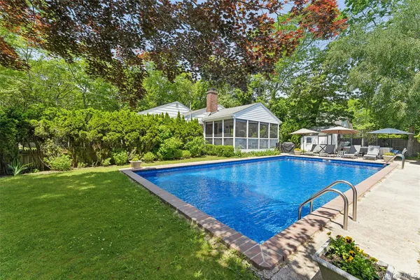 a view of a swimming pool with a deck