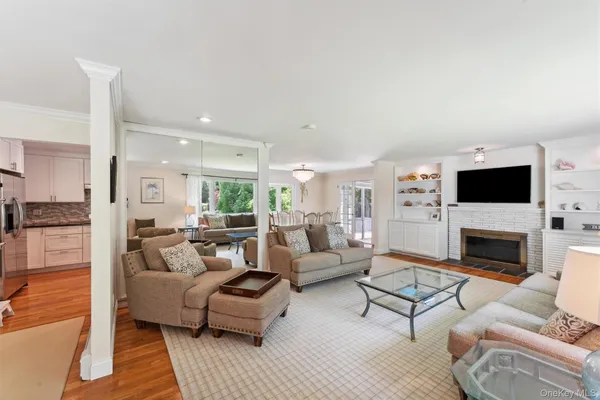 a living room with furniture fireplace and a television