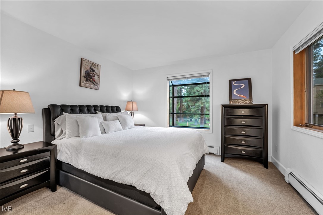 931 Incline Way, Unit 231 Incline Village, NV 89451 - Photo 17 of 39 a bedroom with a bed and a window