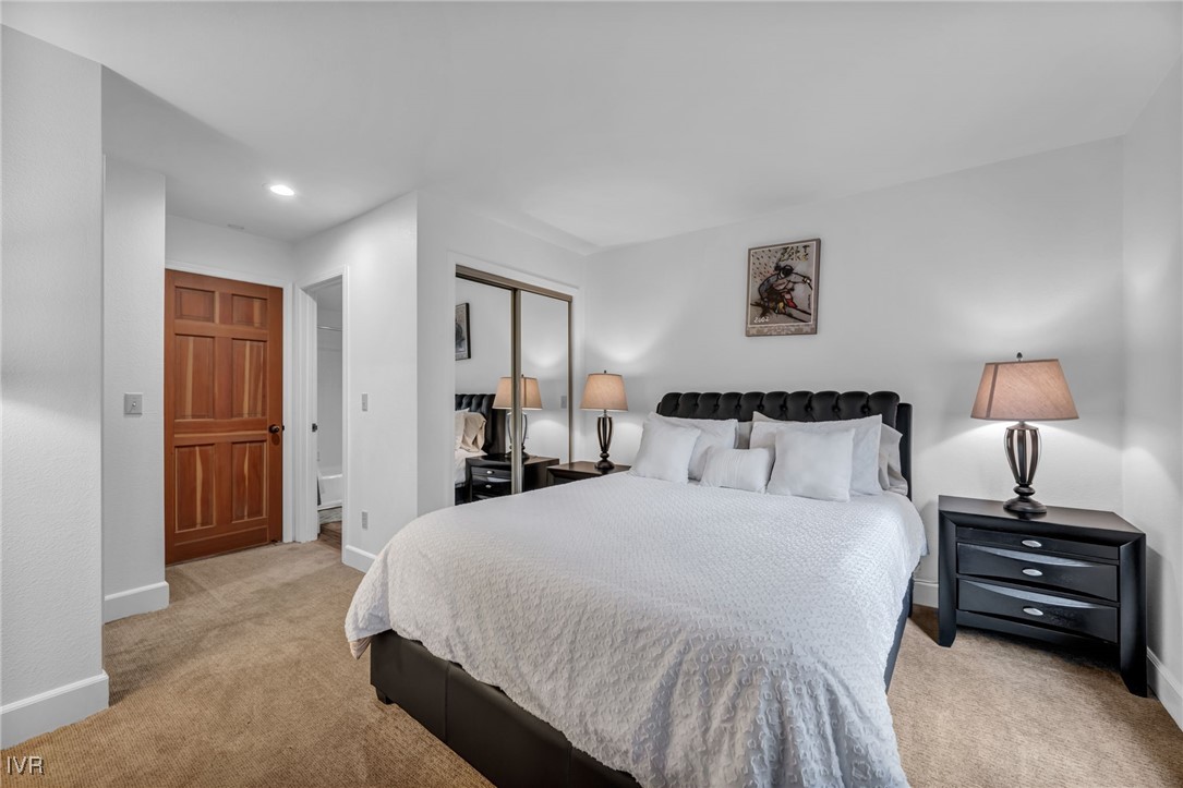 931 Incline Way, Unit 231 Incline Village, NV 89451 - Photo 19 of 39 a bedroom with a bed and a night stand