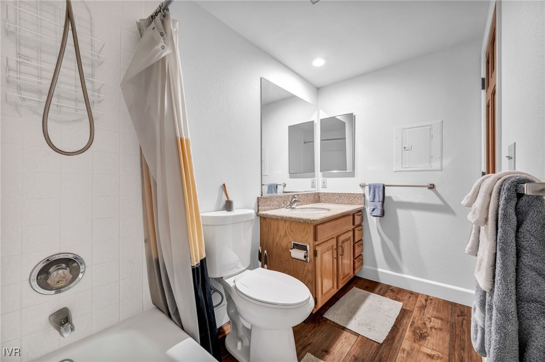 931 Incline Way, Unit 231 Incline Village, NV 89451 - Photo 22 of 39 a bathroom with a granite countertop toilet sink and mirror
